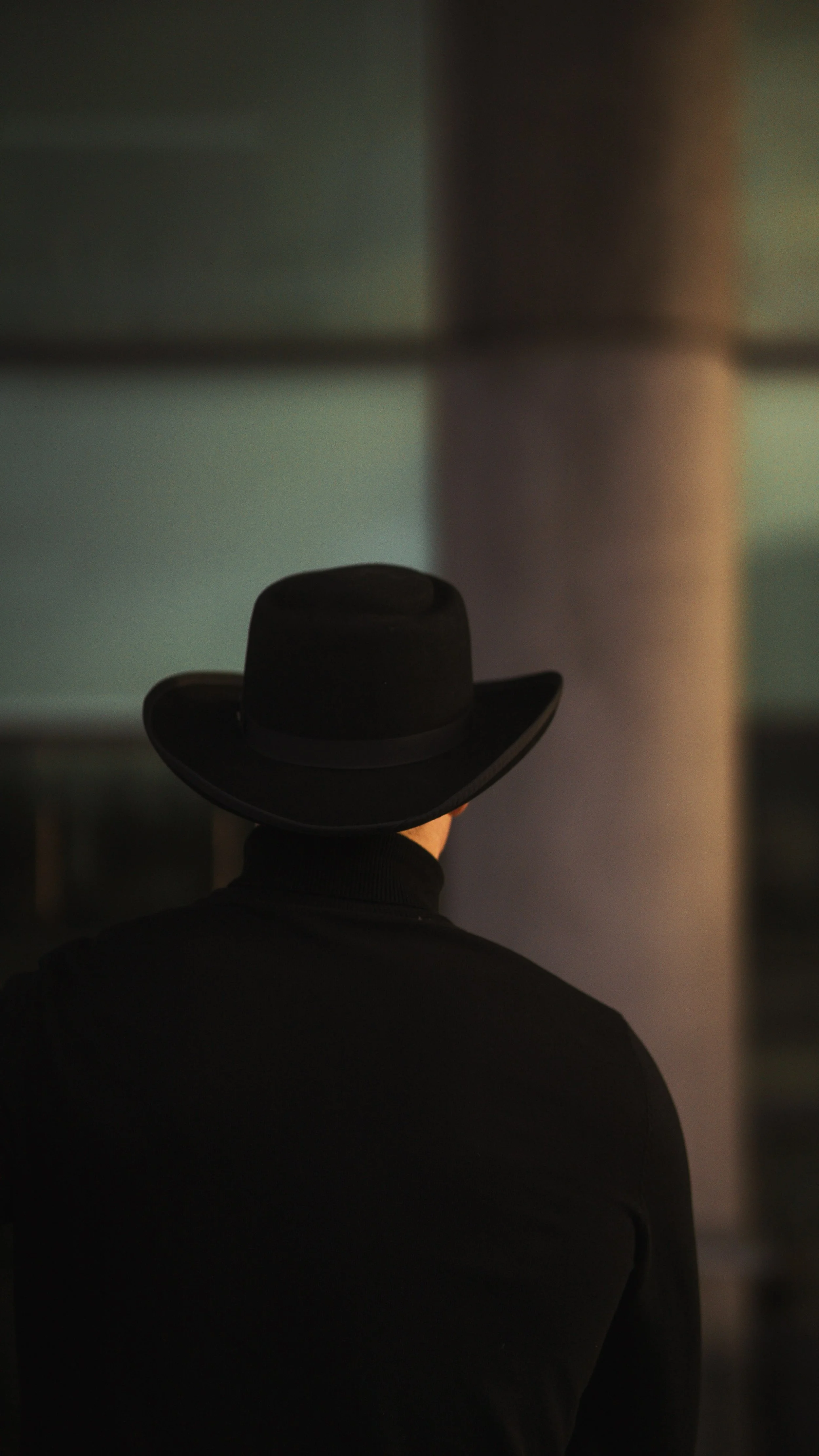 Male from behind wearing a hat.jpg