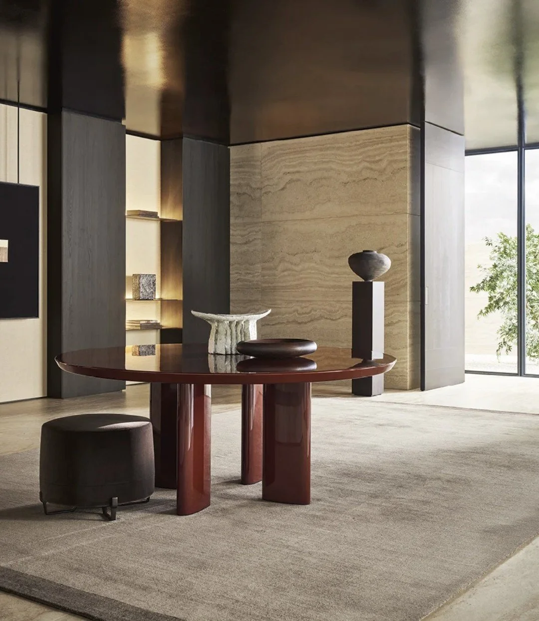 A living environment defined by balance and composure, where reflection and geometry work in quiet harmony. The glossy lacquered Adrien table and the sculptural bookcase by @poliform_official create a dialogue between form and light, shaping a space 