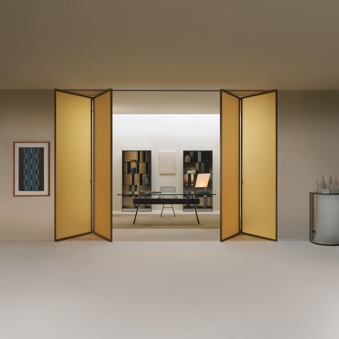 Glass as an articulated surface. @Glasitalia's Sherazade folding screen features patchwork glazed glass panels creating geometric compositions through color and transparency. Each panel catches and filters light differently, transforming the screen i