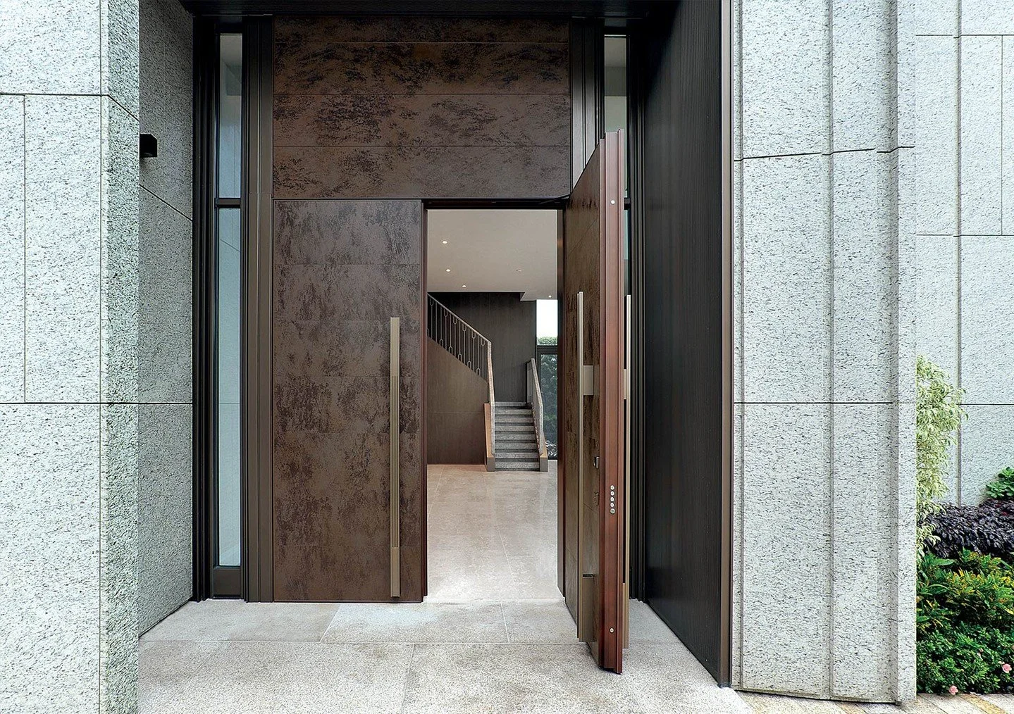 Door systems engineered for residential performance. The Tekno collection by @oikos_official features minimalist design meeting comprehensive security and acoustic specifications. Flush-mounted profiles create coplanar alignment with surrounding wall