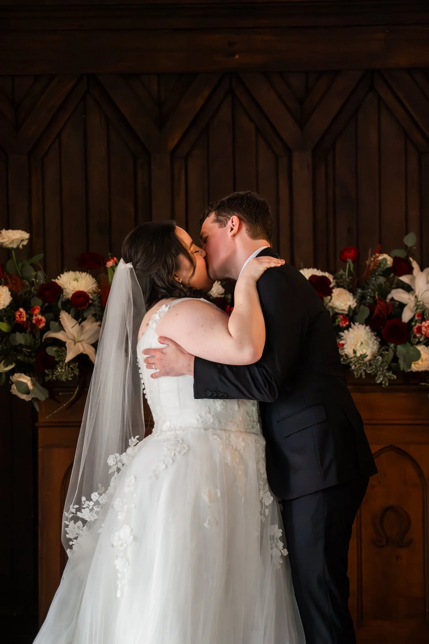 ll-saints-chapel-raleigh-nc-wedding-first-kiss-close.jpg