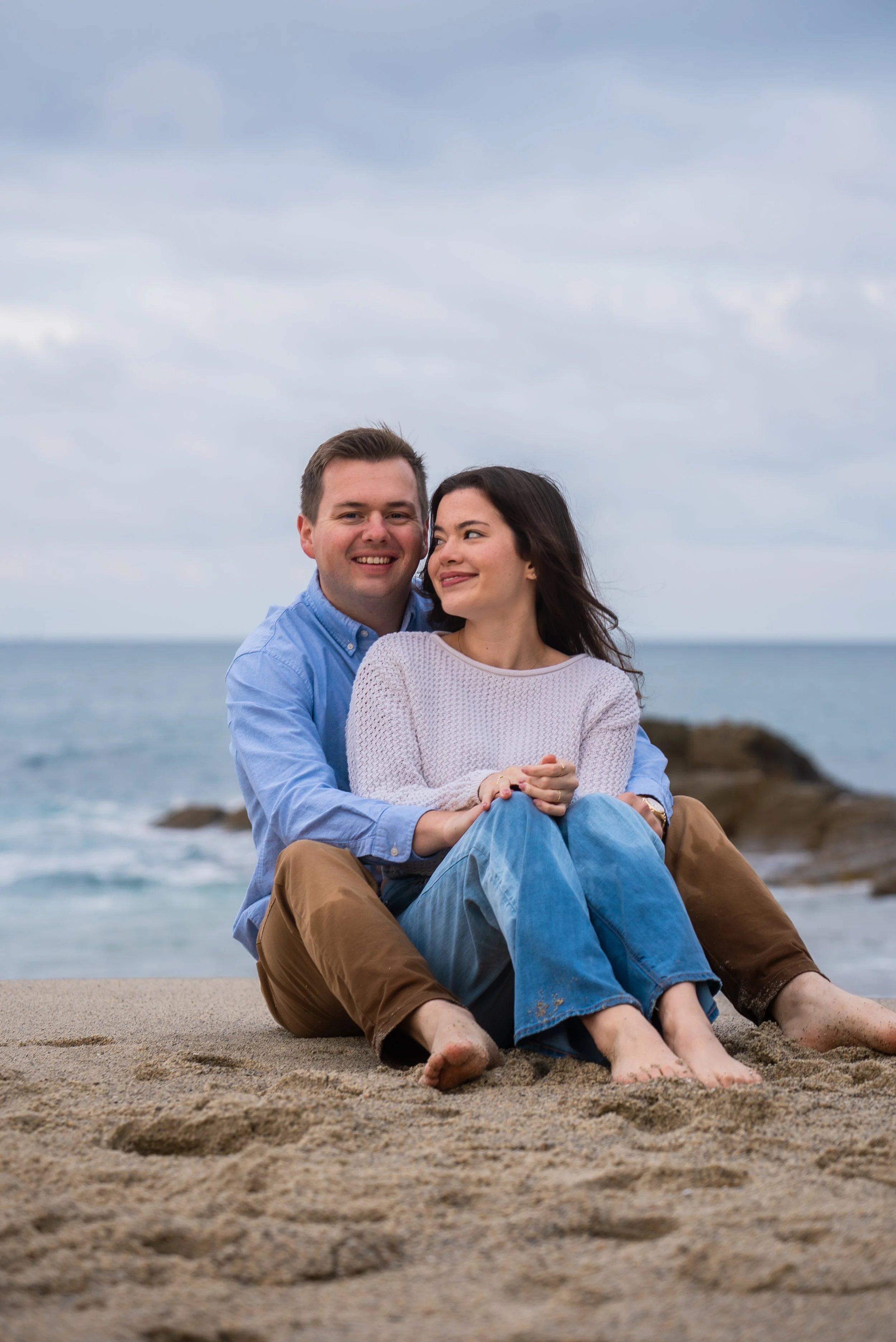 laguna-beach-couples-photographer-sitting-on-sand.jpg