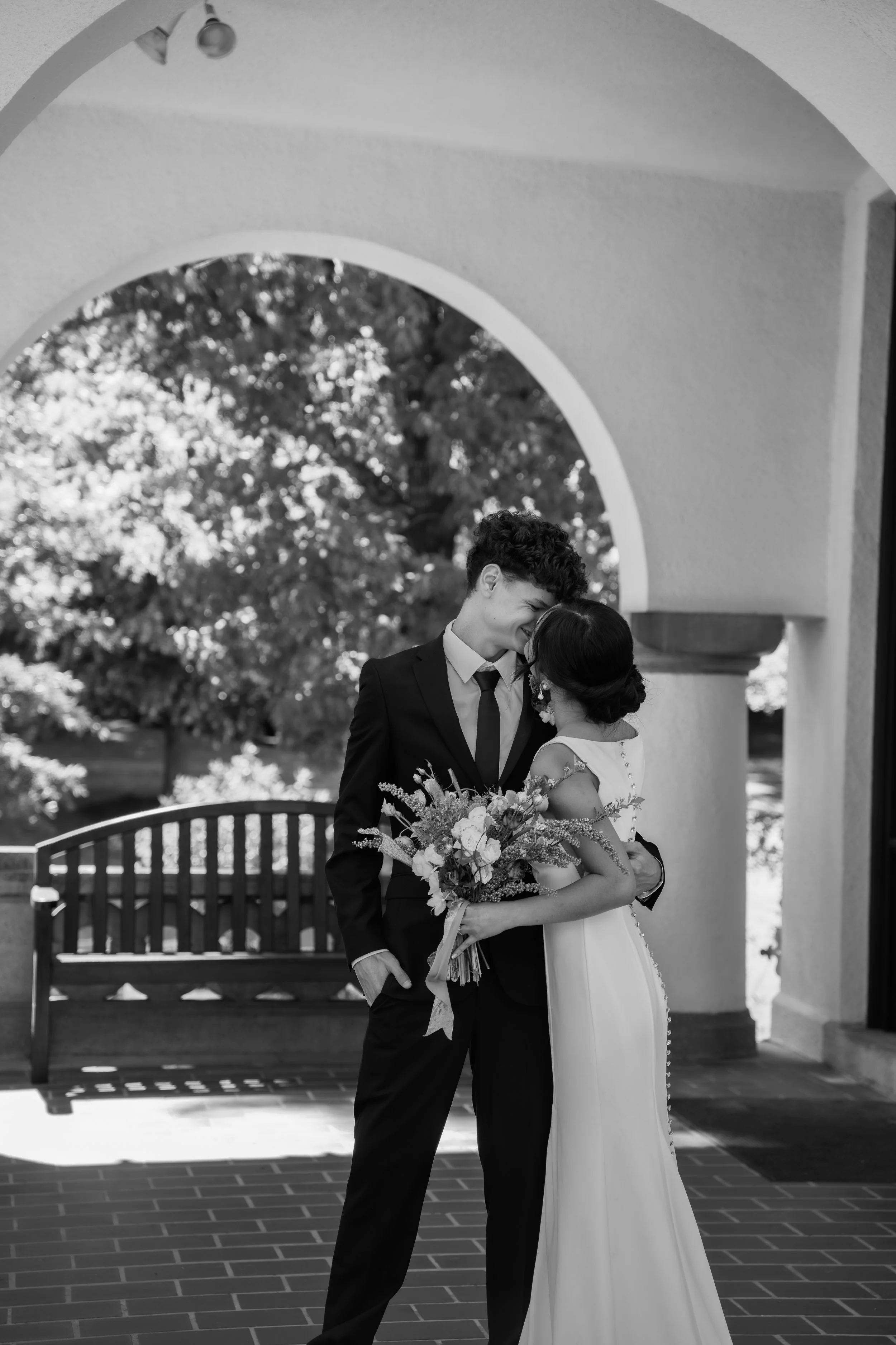 hill-house-durham-nc-wedding-black-and-white-archway-kiss.jpg