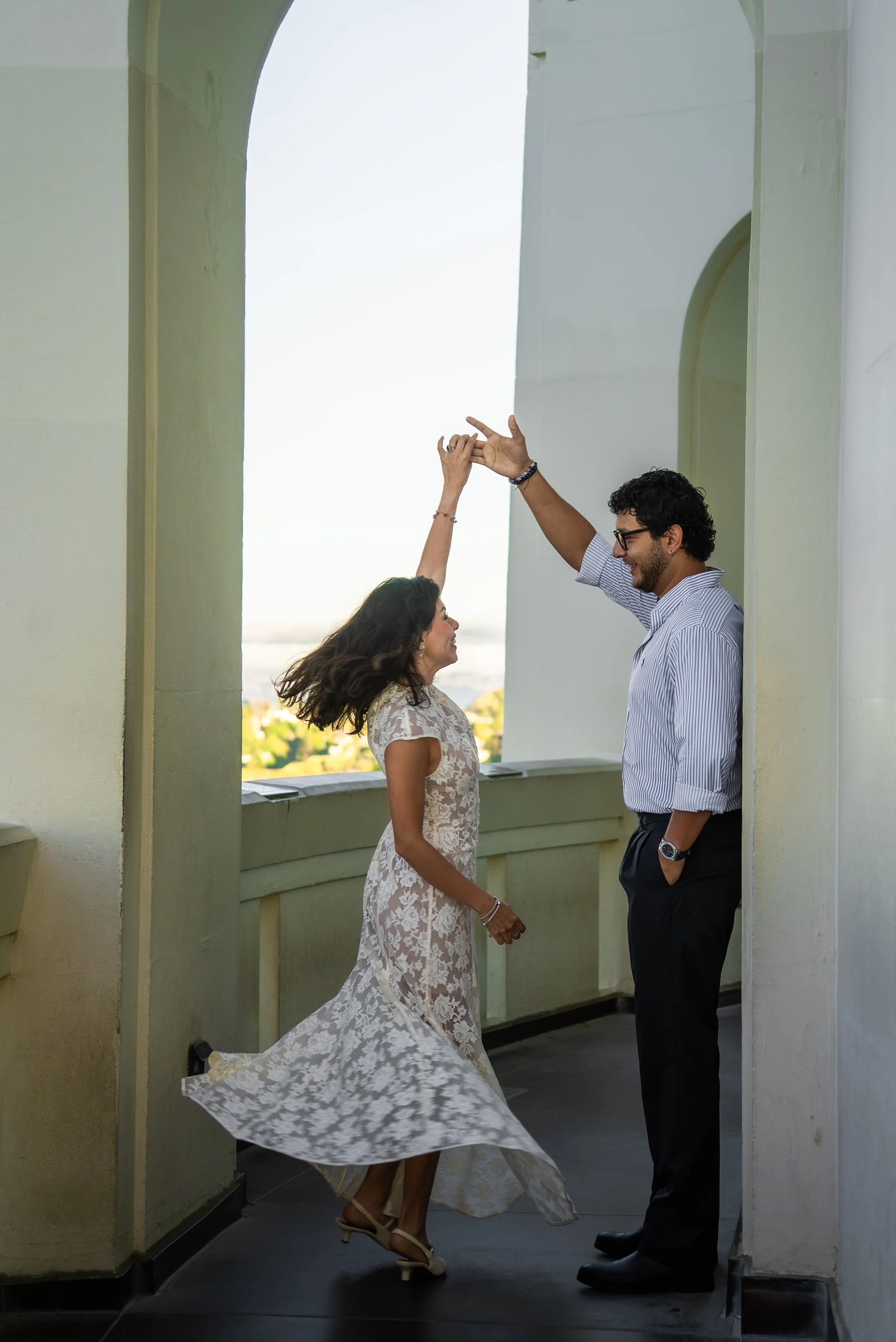 griffith-observatory-los-angeles-couples-session-archway-twirl.jpg