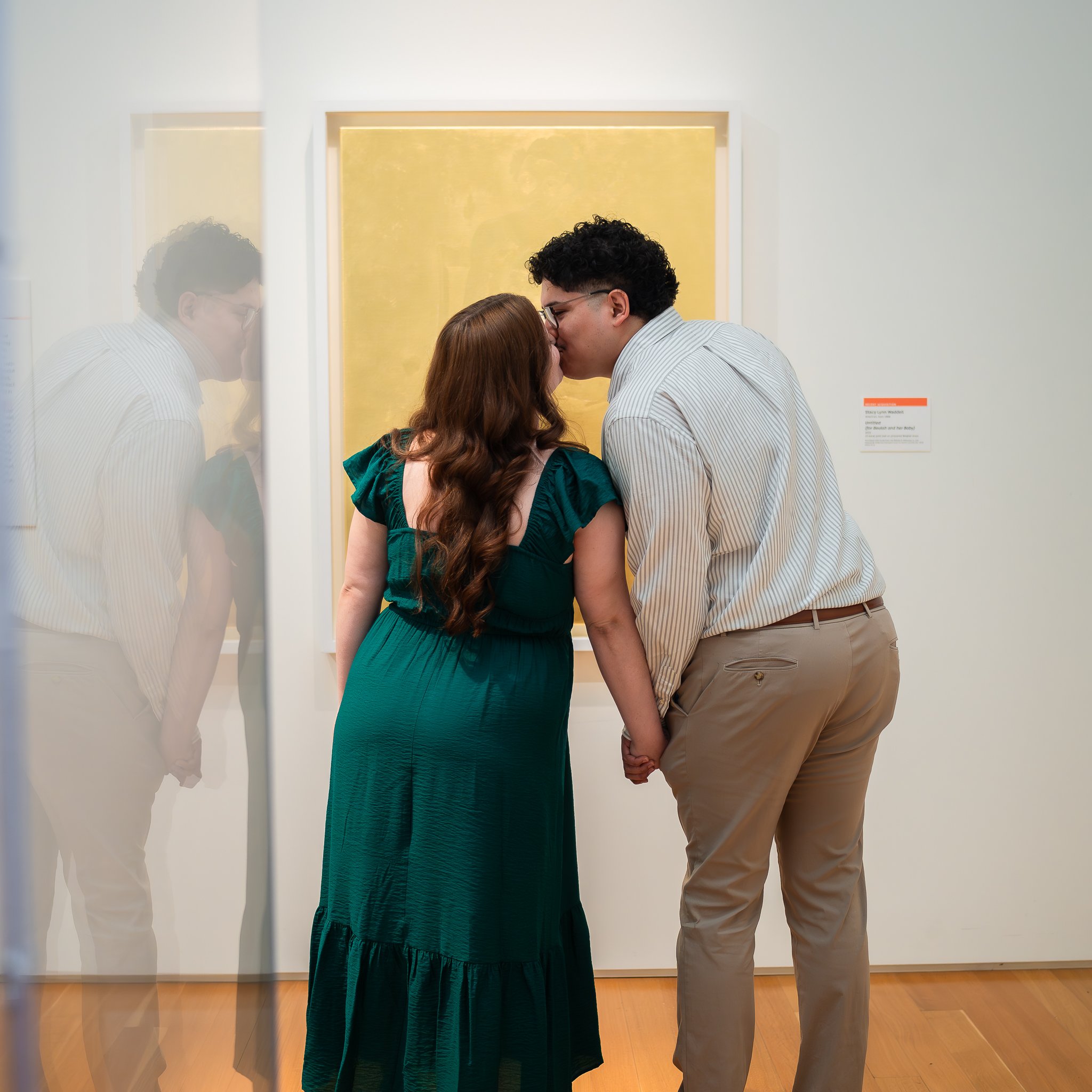 nc-museum-of-art-raleigh-nc-engagement-session-kiss-in-gallery.jpg
