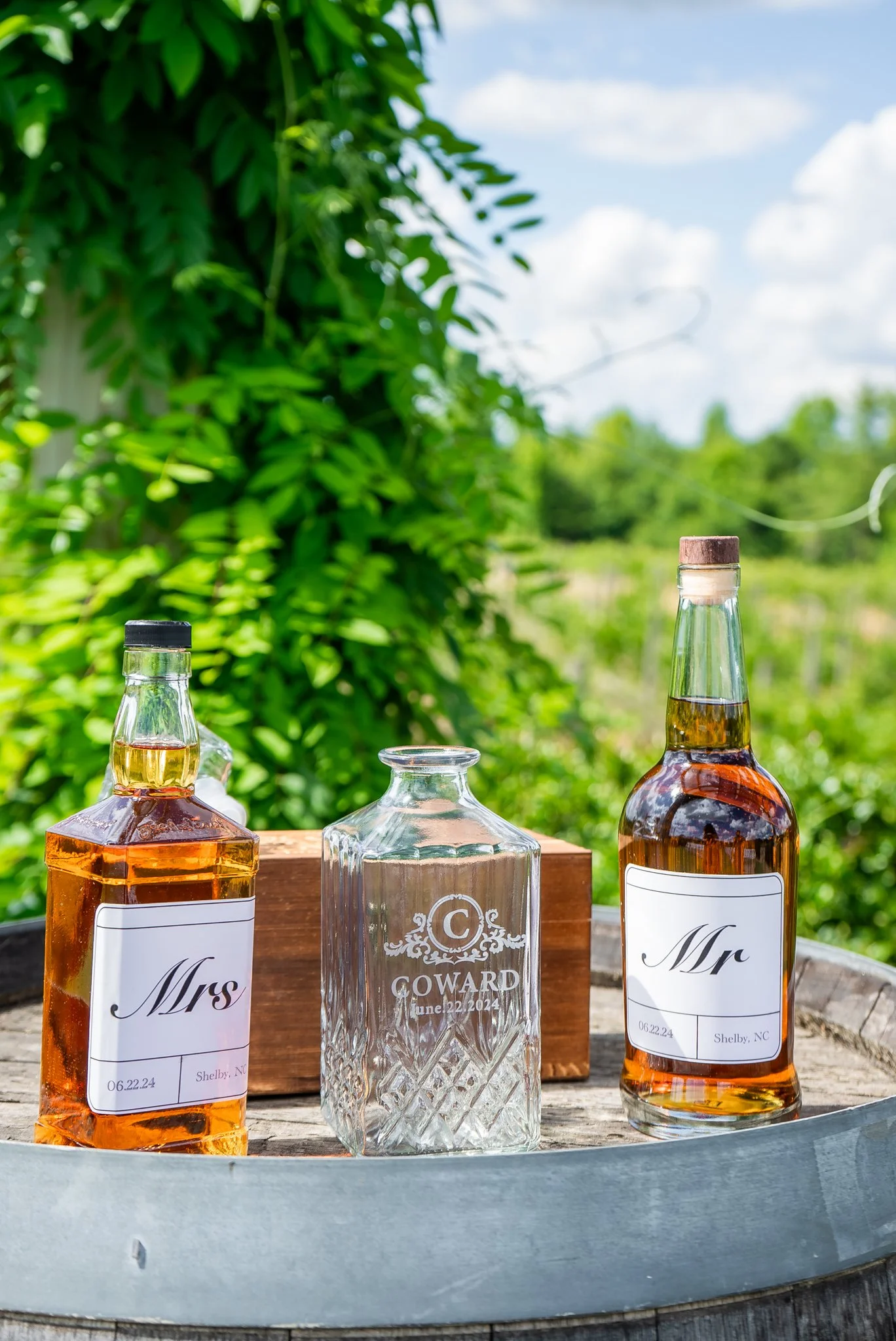 Personalized Mr. and Mrs. wedding whiskey bottles and engraved decanter at Spinning Leaf at the Vineyard wedding