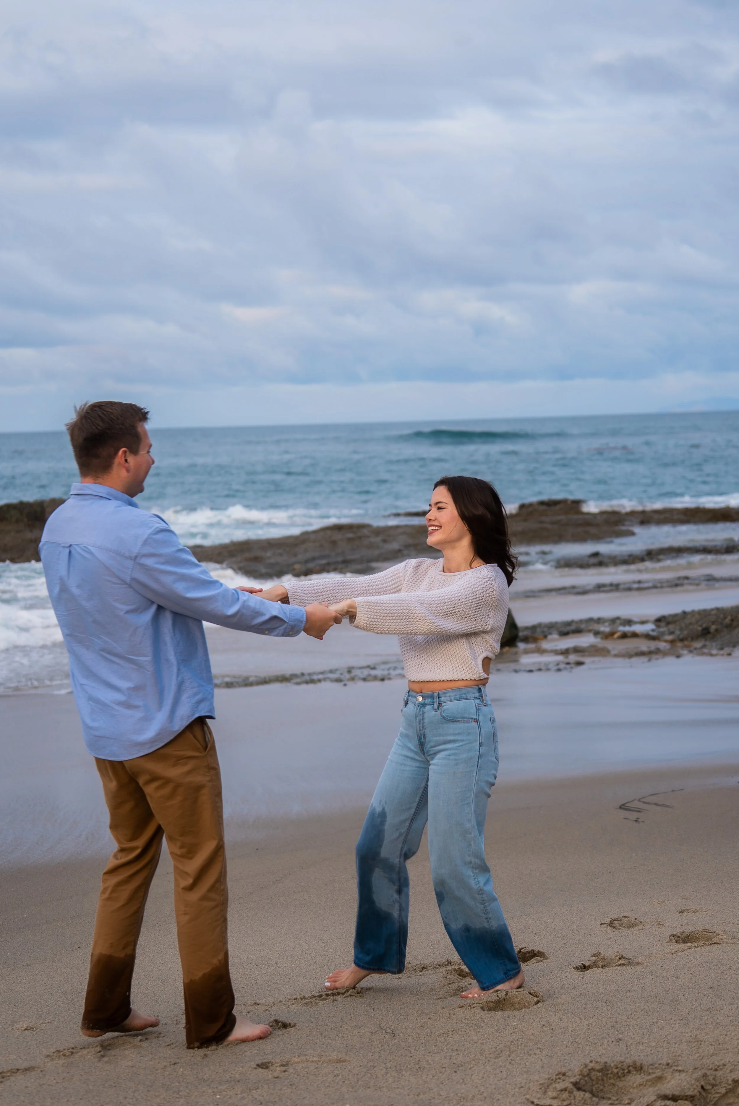 laguna-beach-couples-photographer-spinning-on-beach.jpg