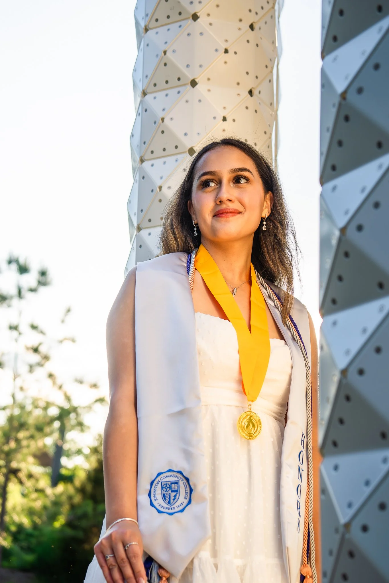 downtown-cary-park-graduation-session-medals-portrait.jpg