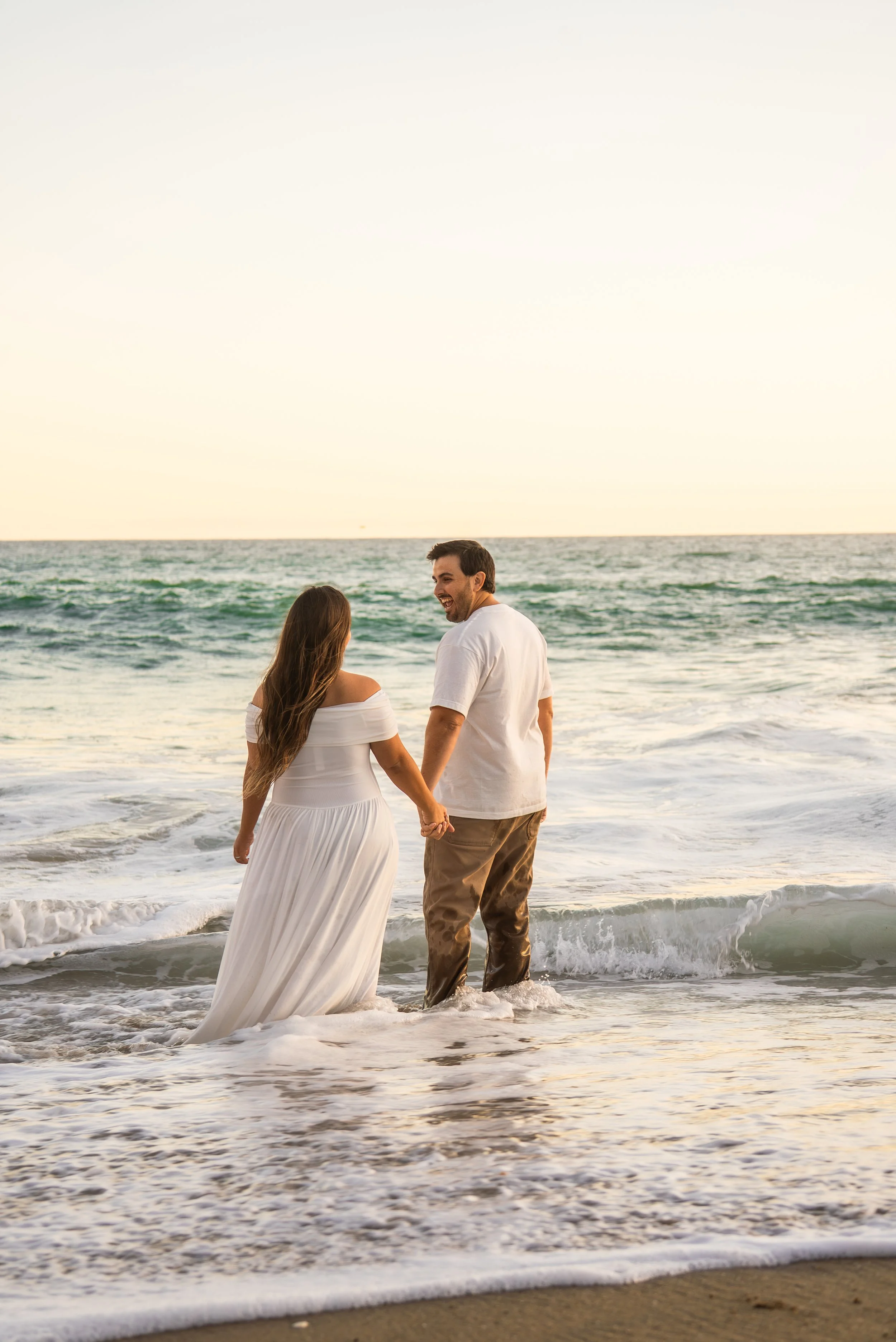 crescent-bay-beach-laguna-beach-ca-maternity-session-walking-ocean.jpg