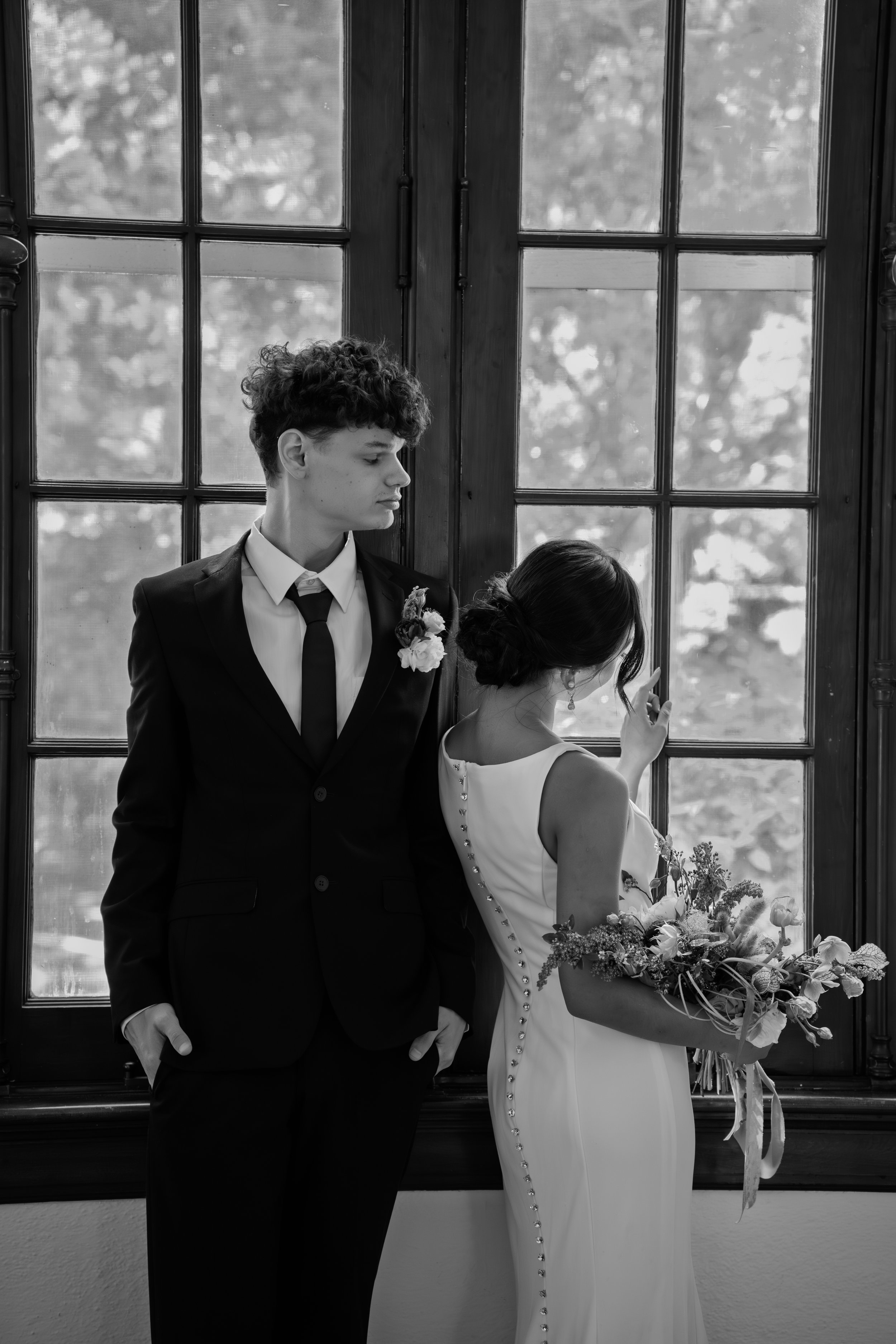 hill-house-durham-nc-wedding-window-embrace-black-and-white.jpg