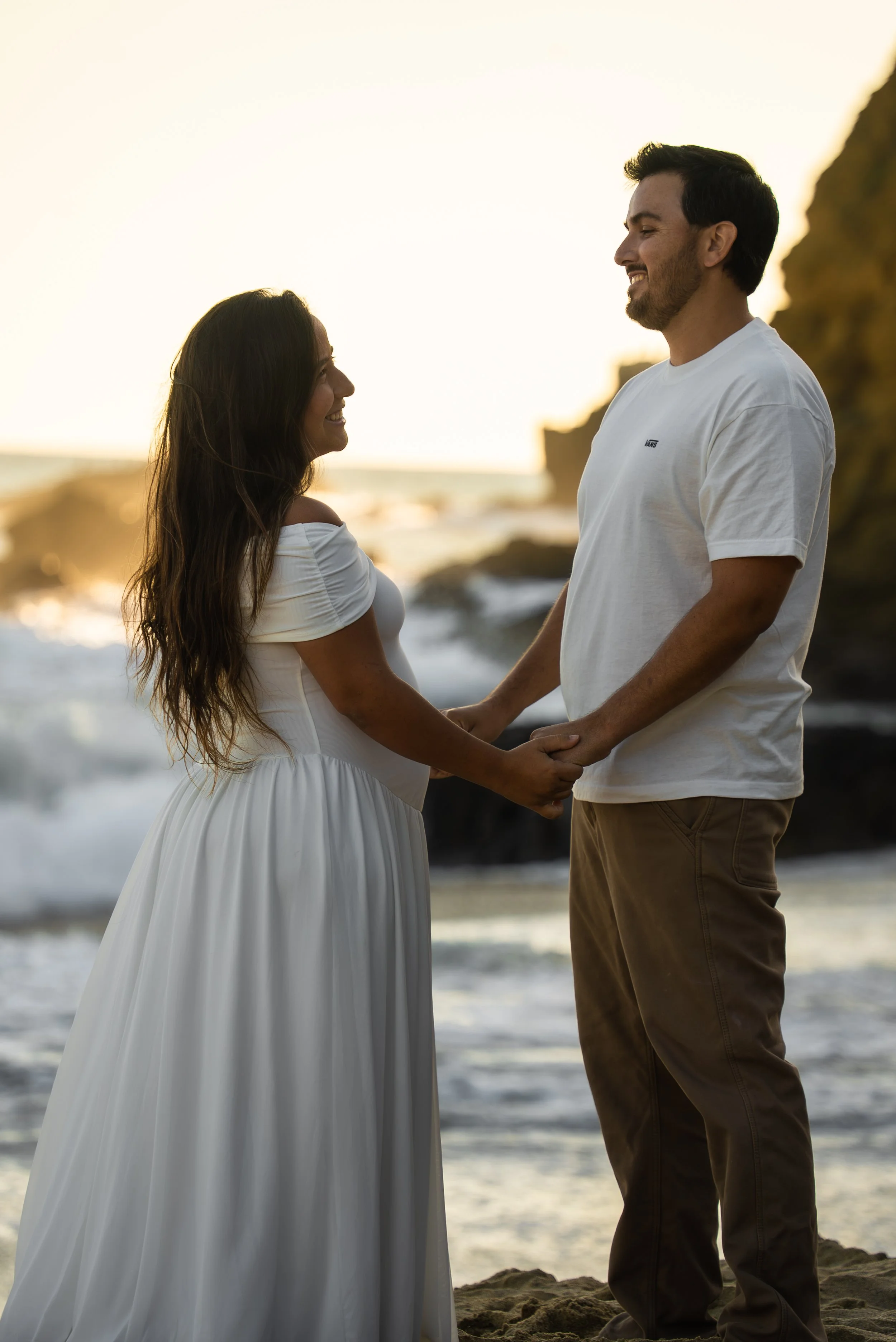 crescent-bay-beach-laguna-beach-ca-maternity-session-holding-hands.jpg