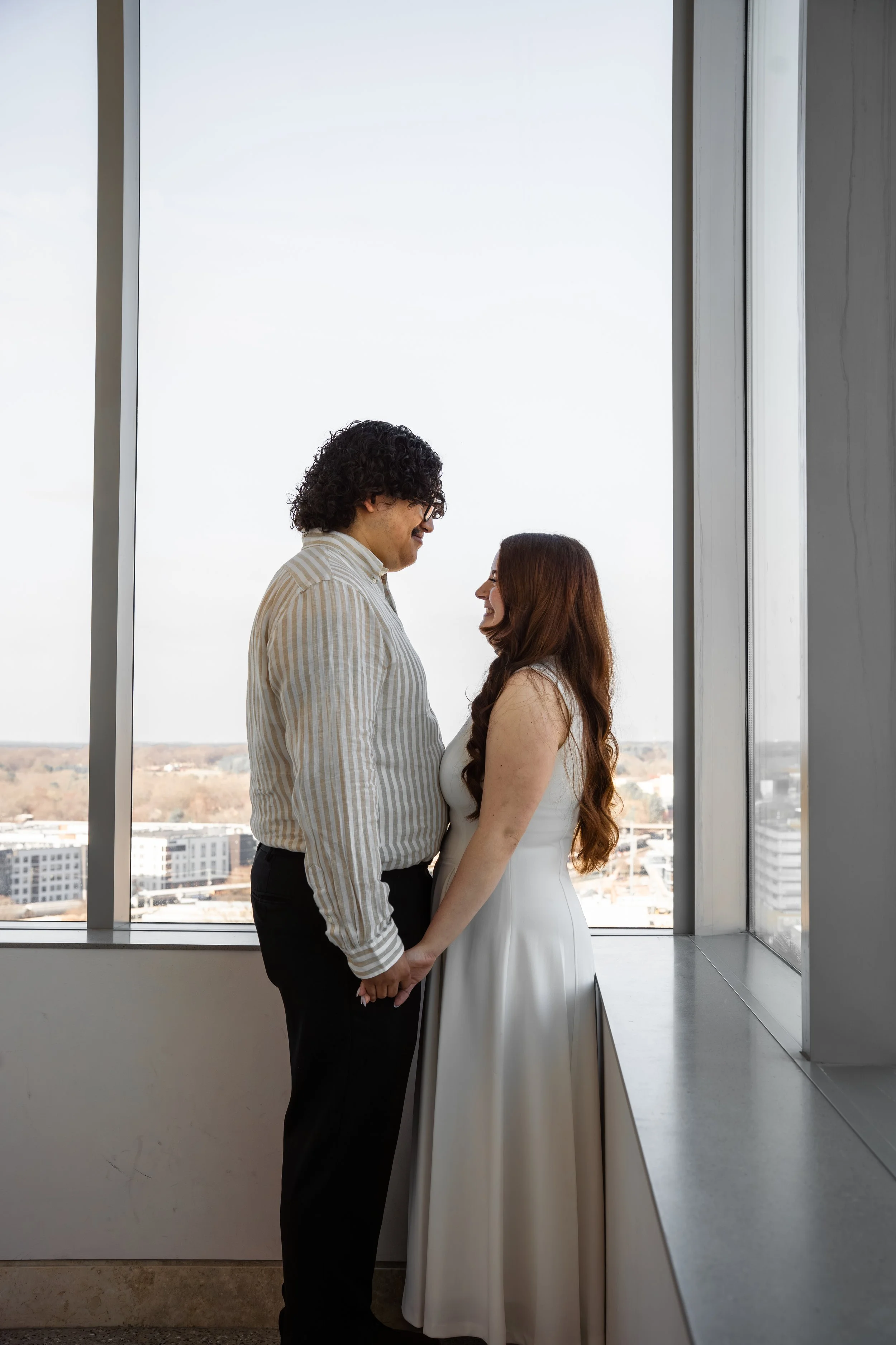 wake-county-justice-center-civil-wedding-raleigh-nc-window-embrace.jpg