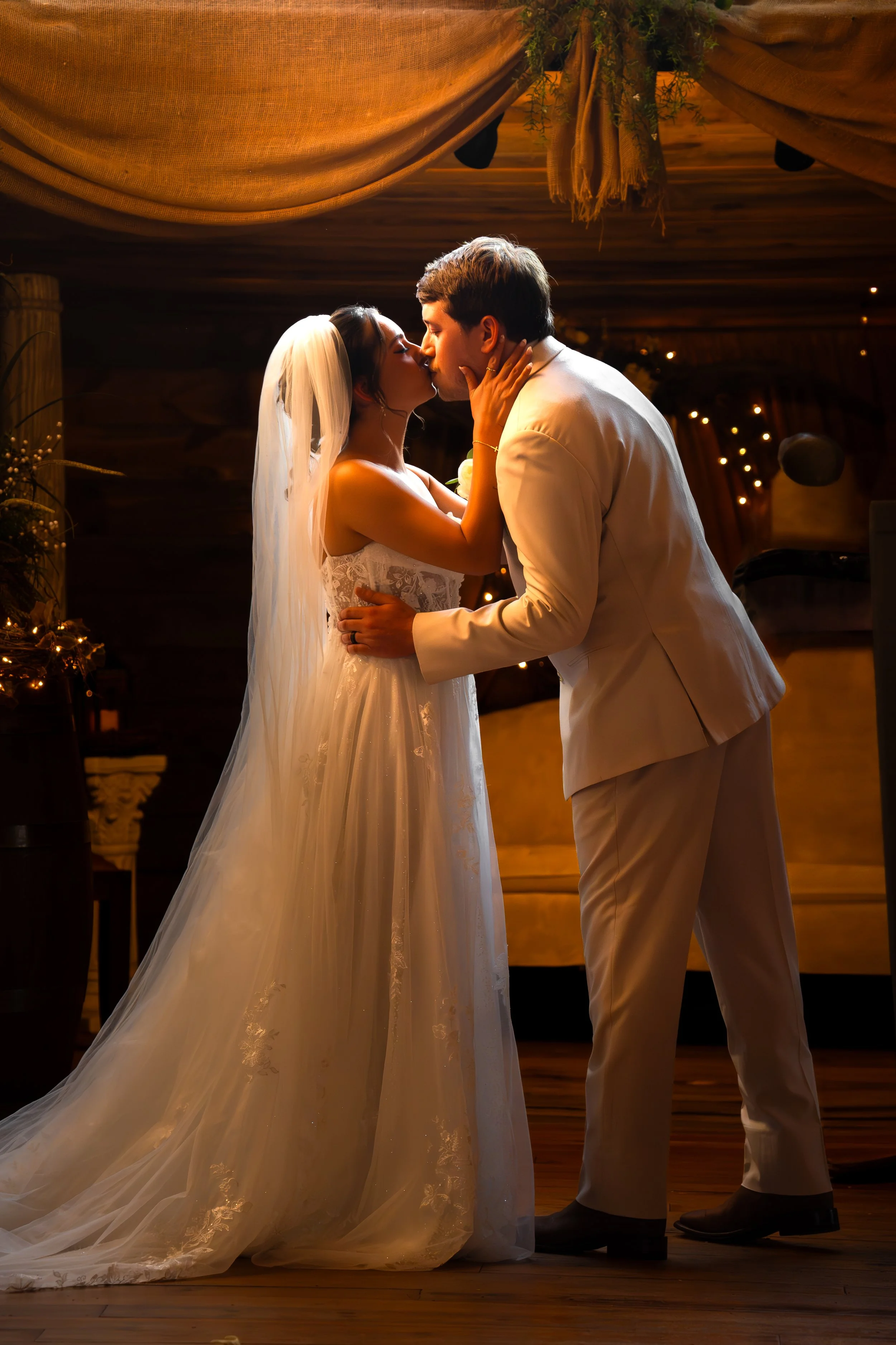 skyler-ben-wedding-ceremony-first-kiss-double-c-ranch-coats-nc.jpg