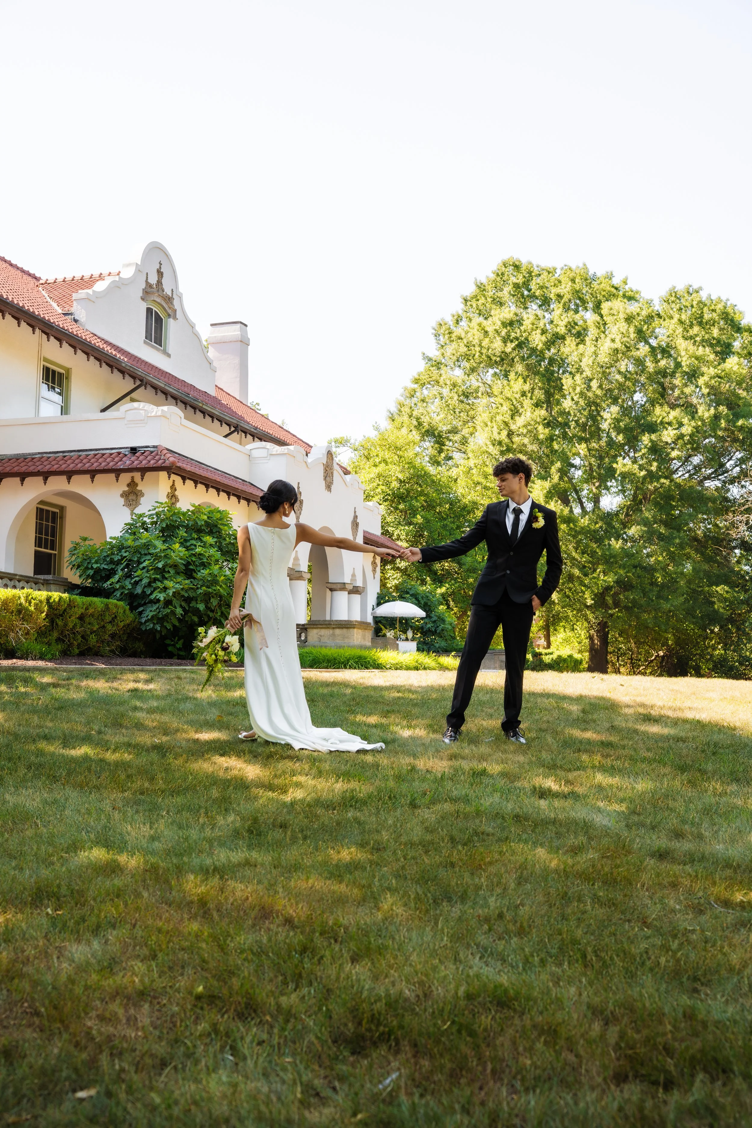 hill-house-durham-nc-wedding-twirl-on-lawn.jpg