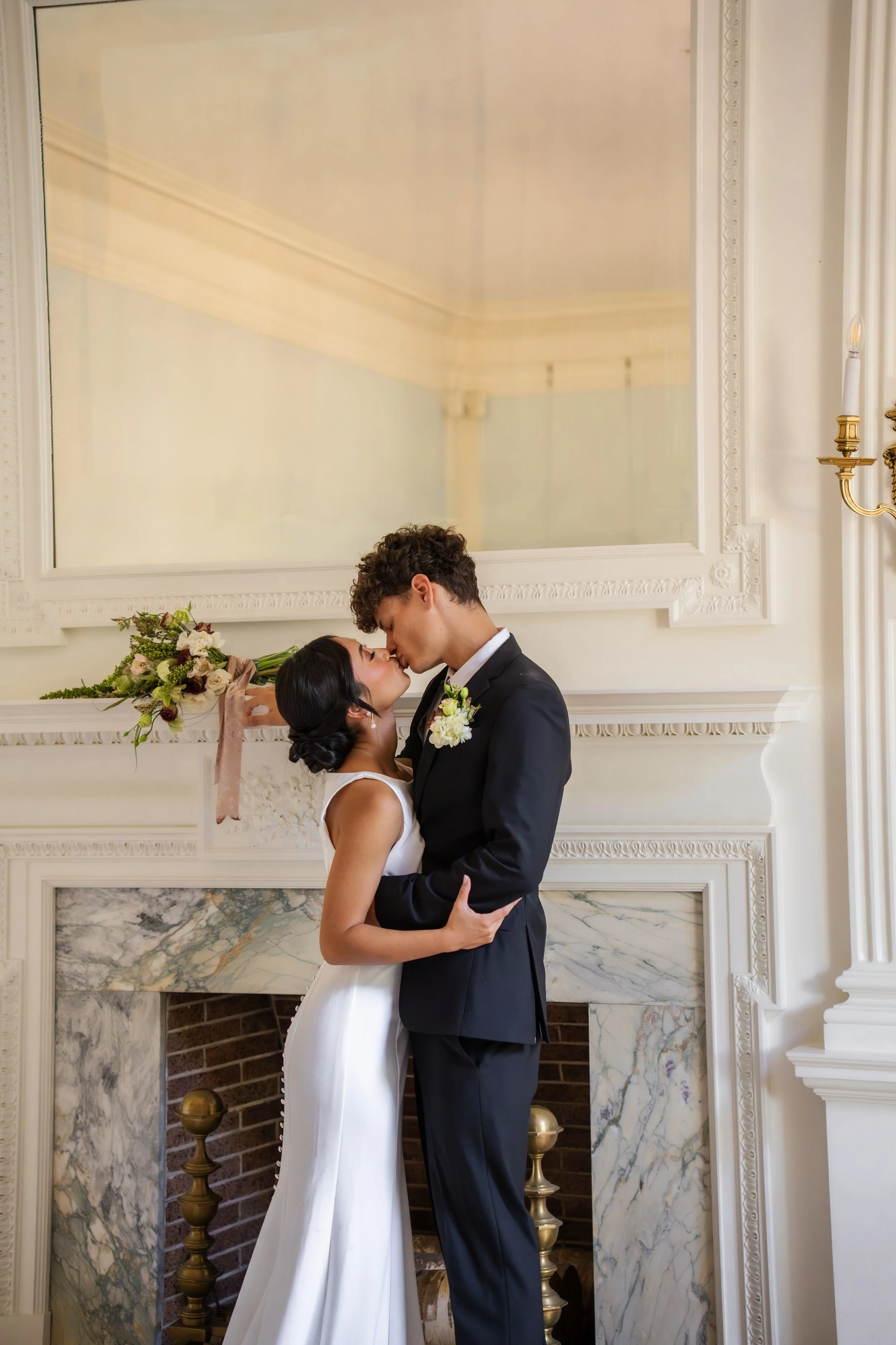 hill-house-durham-nc-wedding-fireplace-kiss.jpg