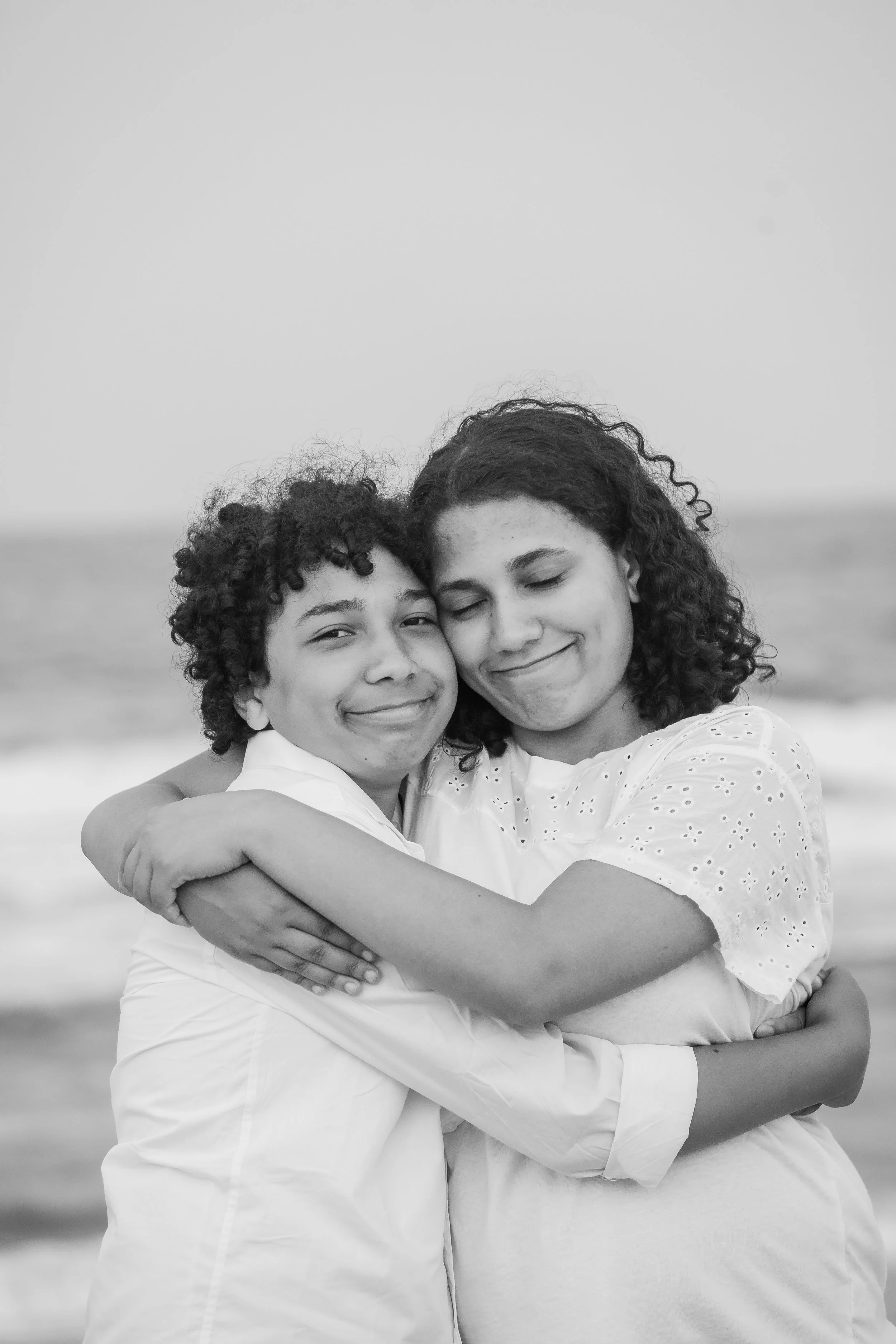 carolina-beach-family-photographer-sibling-hug.jpg