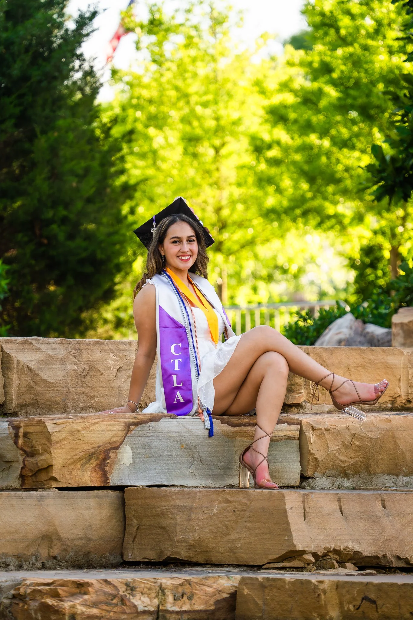downtown-cary-park-graduation-session-stone-wall-sitting.jpg