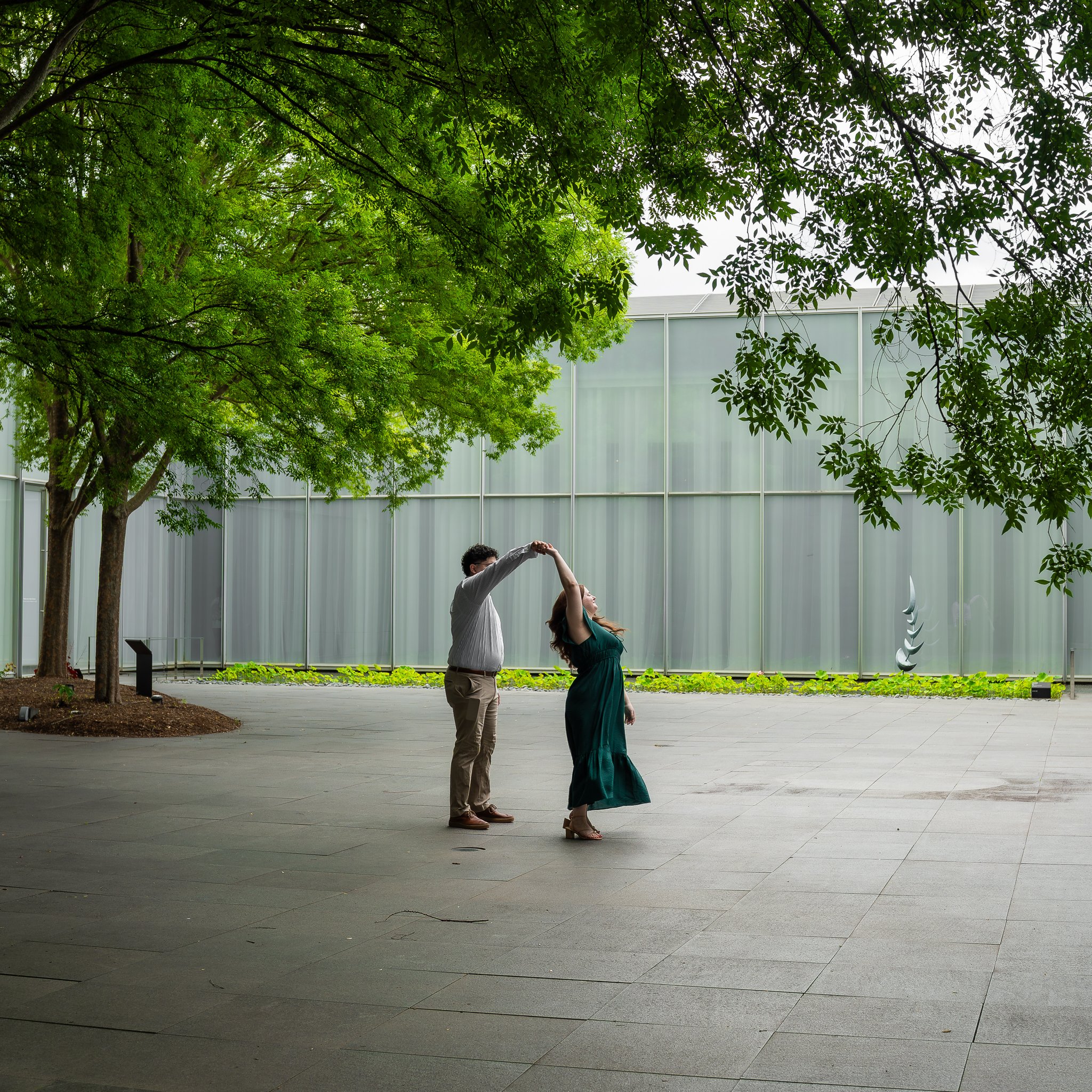 nc-museum-of-art-raleigh-nc-engagement-session-twirl-outside.jpg