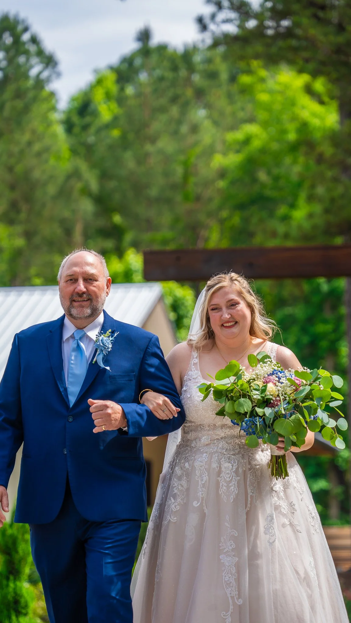 april-bride-walking-down-aisle-mini-acre-farms-raleigh-nc.jpg