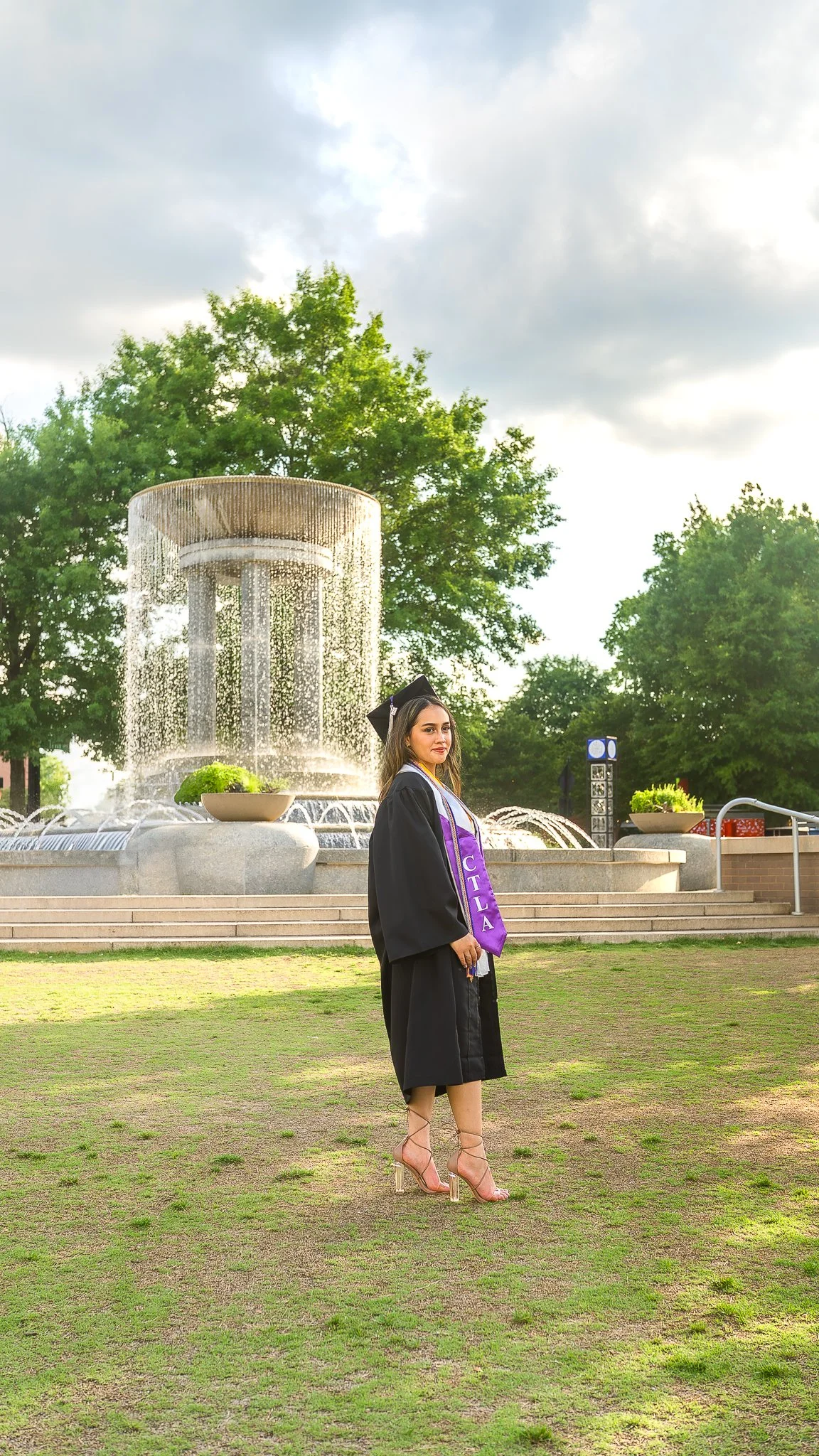 downtown-cary-park-graduation-session-fountain-cap-and-gown.jpg