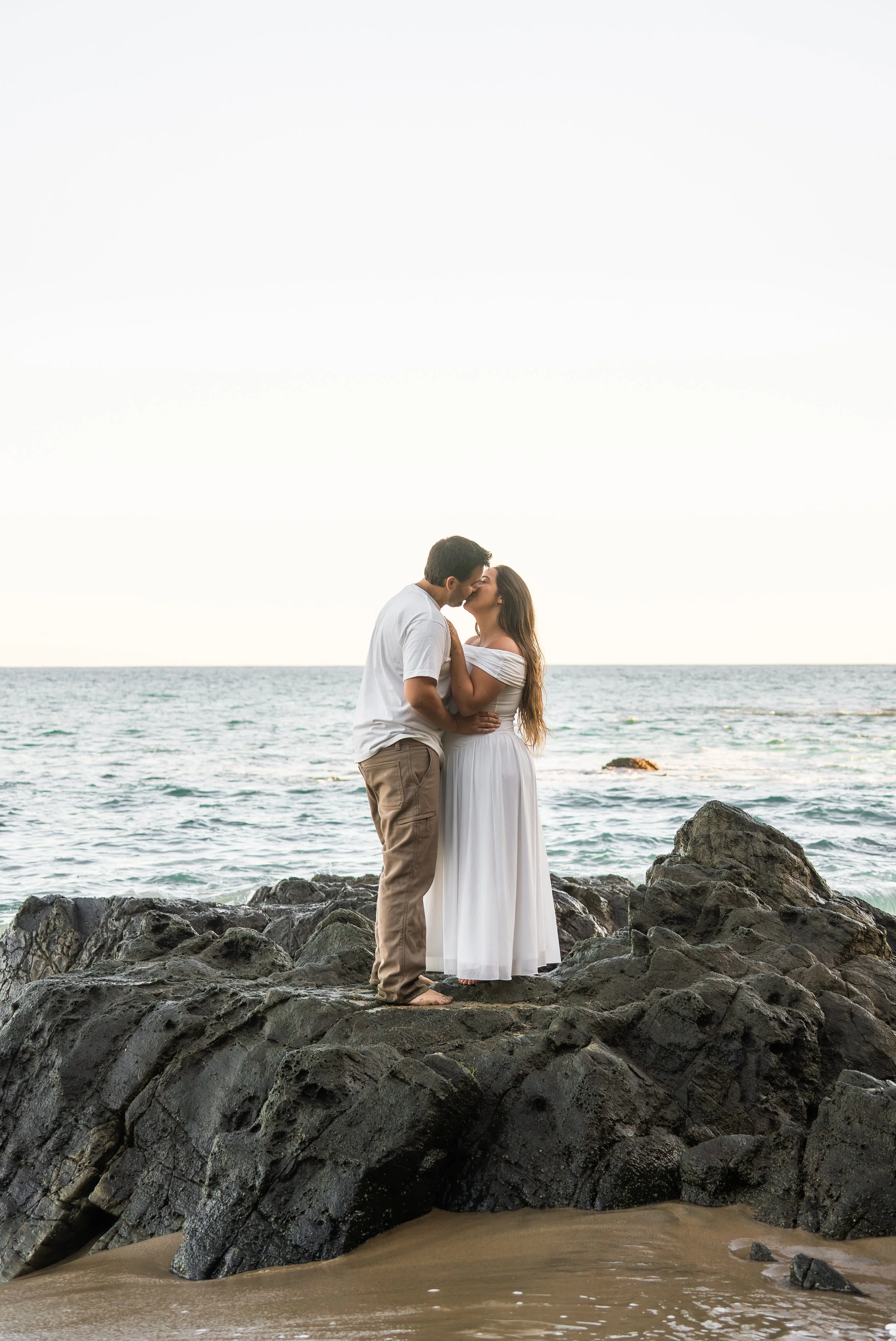 crescent-bay-beach-laguna-beach-ca-maternity-session-rocks-kiss.jpg