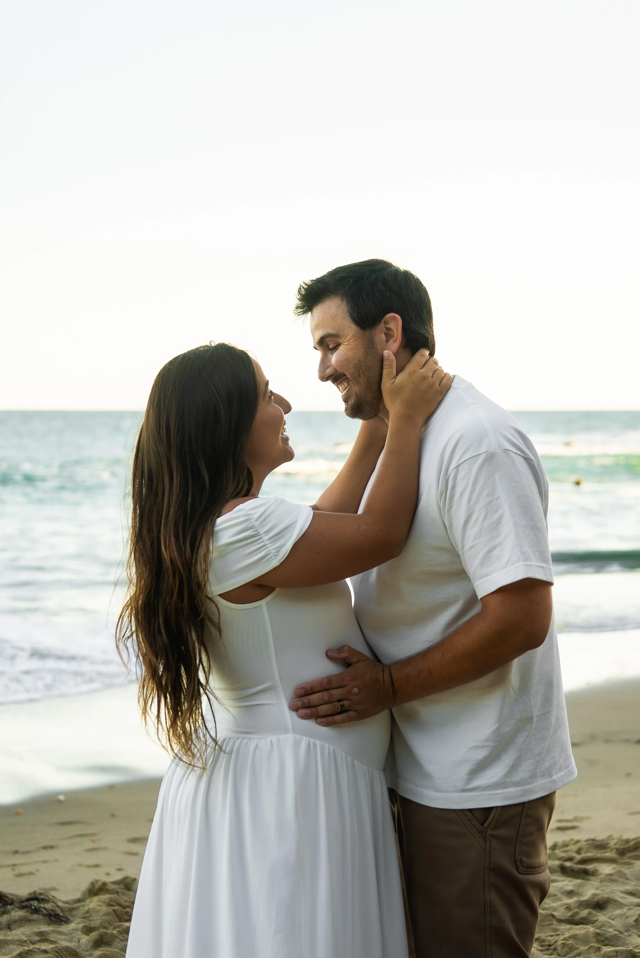 crescent-bay-beach-laguna-beach-ca-maternity-session-beach-embrace-close.jpg