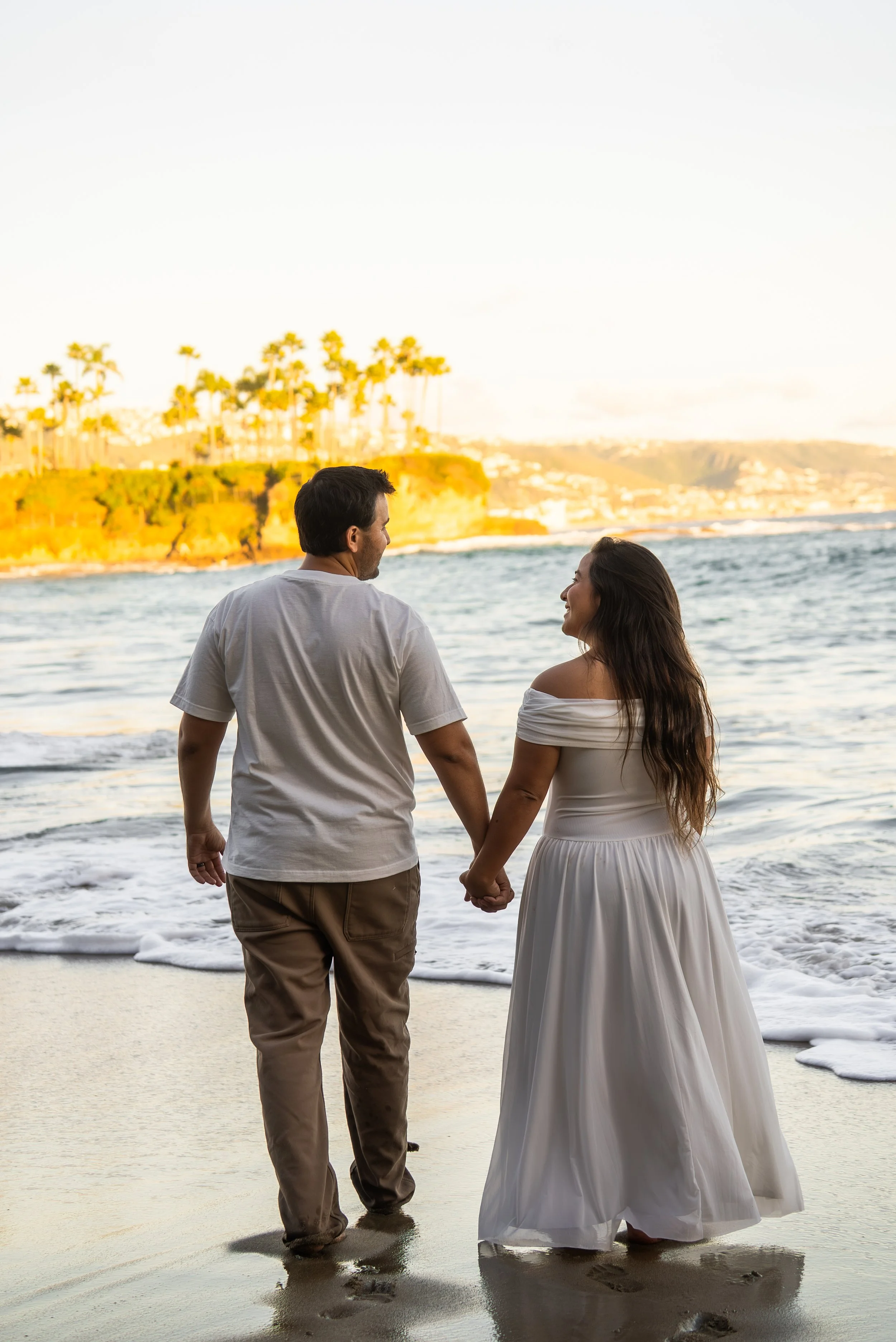 crescent-bay-beach-laguna-beach-ca-maternity-session-walking-waterline.jpg