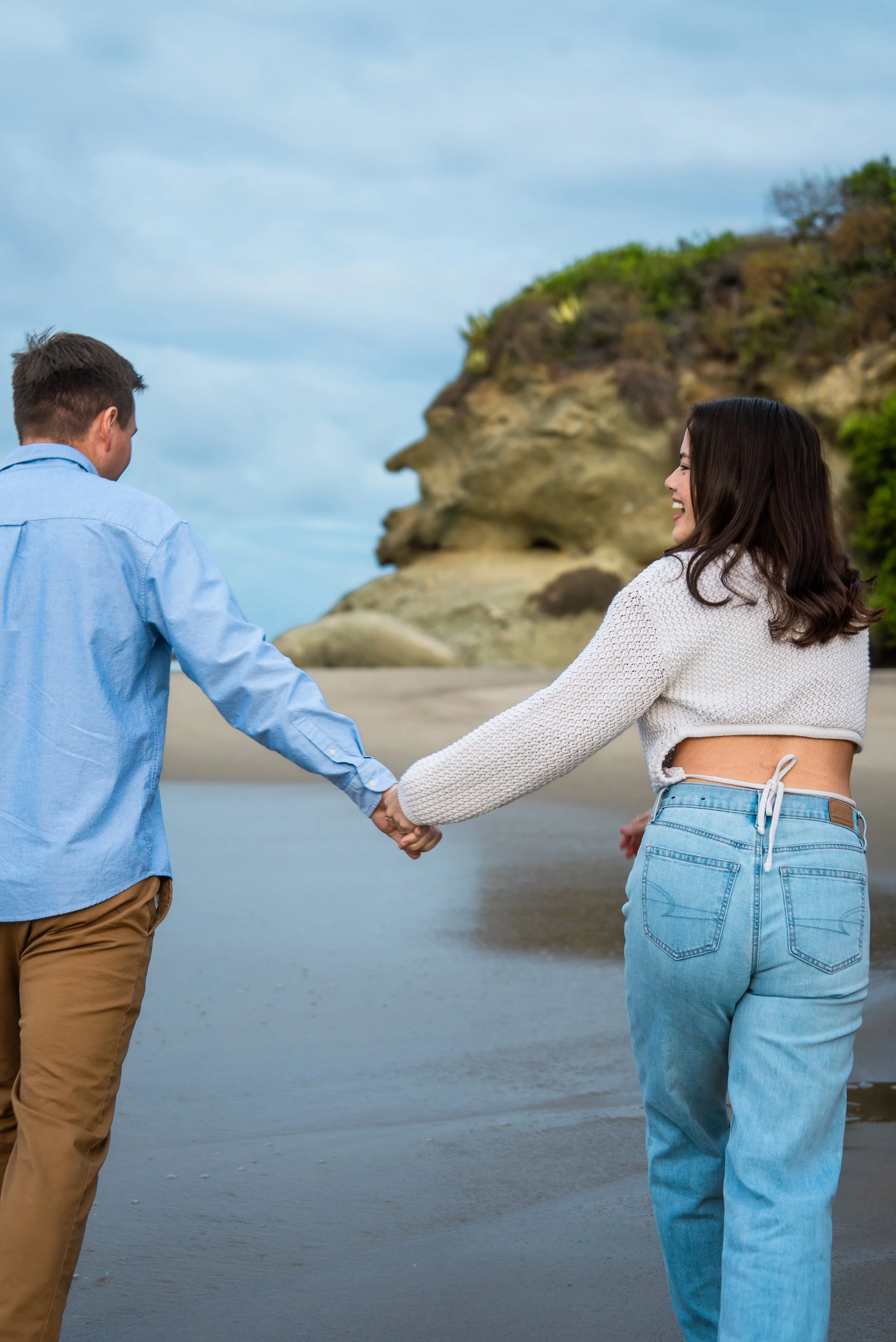 laguna-beach-couples-photographer-holding-hands-beach.jpg