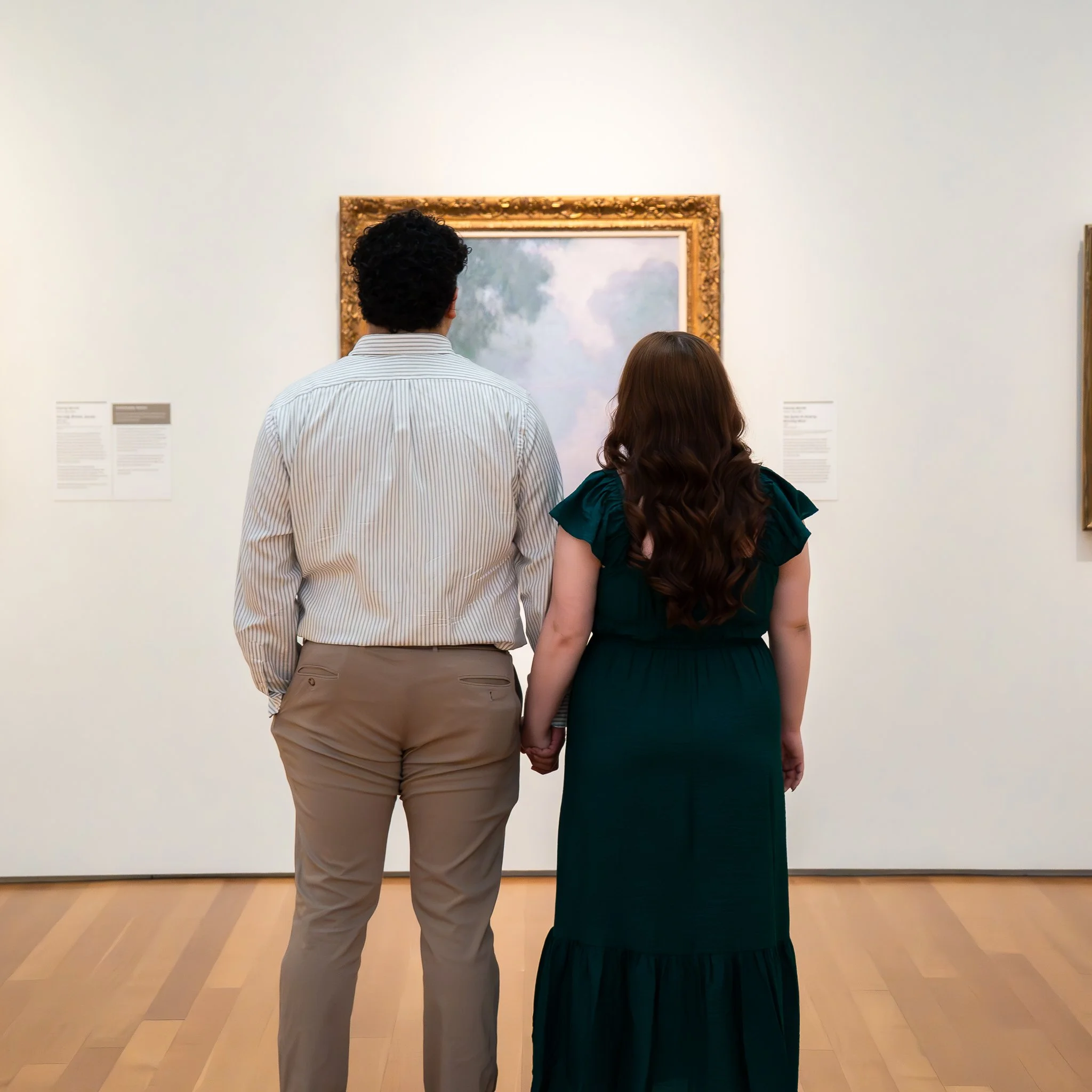 nc-museum-of-art-raleigh-nc-engagement-session-looking-at-painting.jpg
