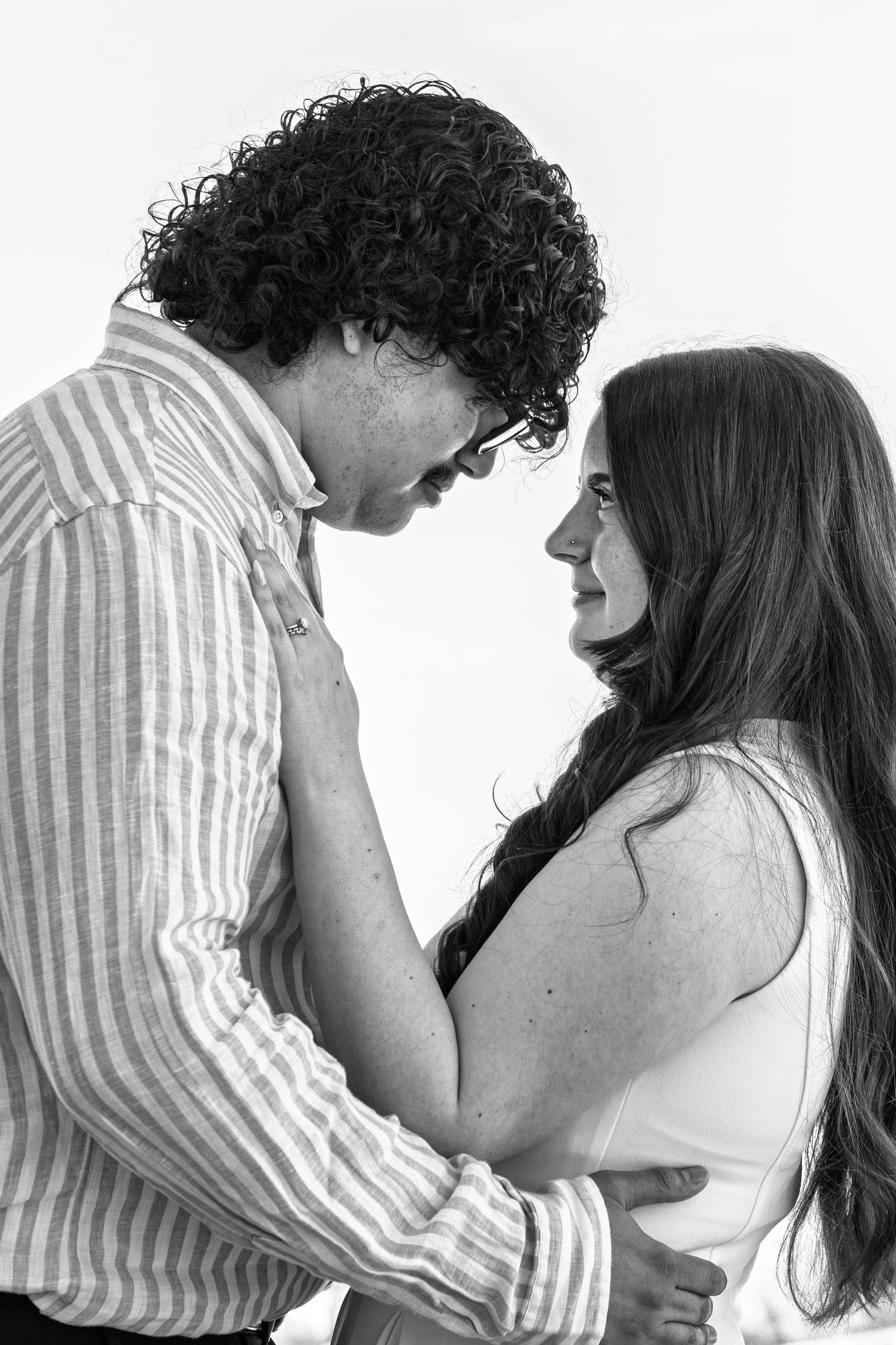 wake-county-justice-center-civil-wedding-raleigh-nc-window-close-embrace-black-and-white.jpg