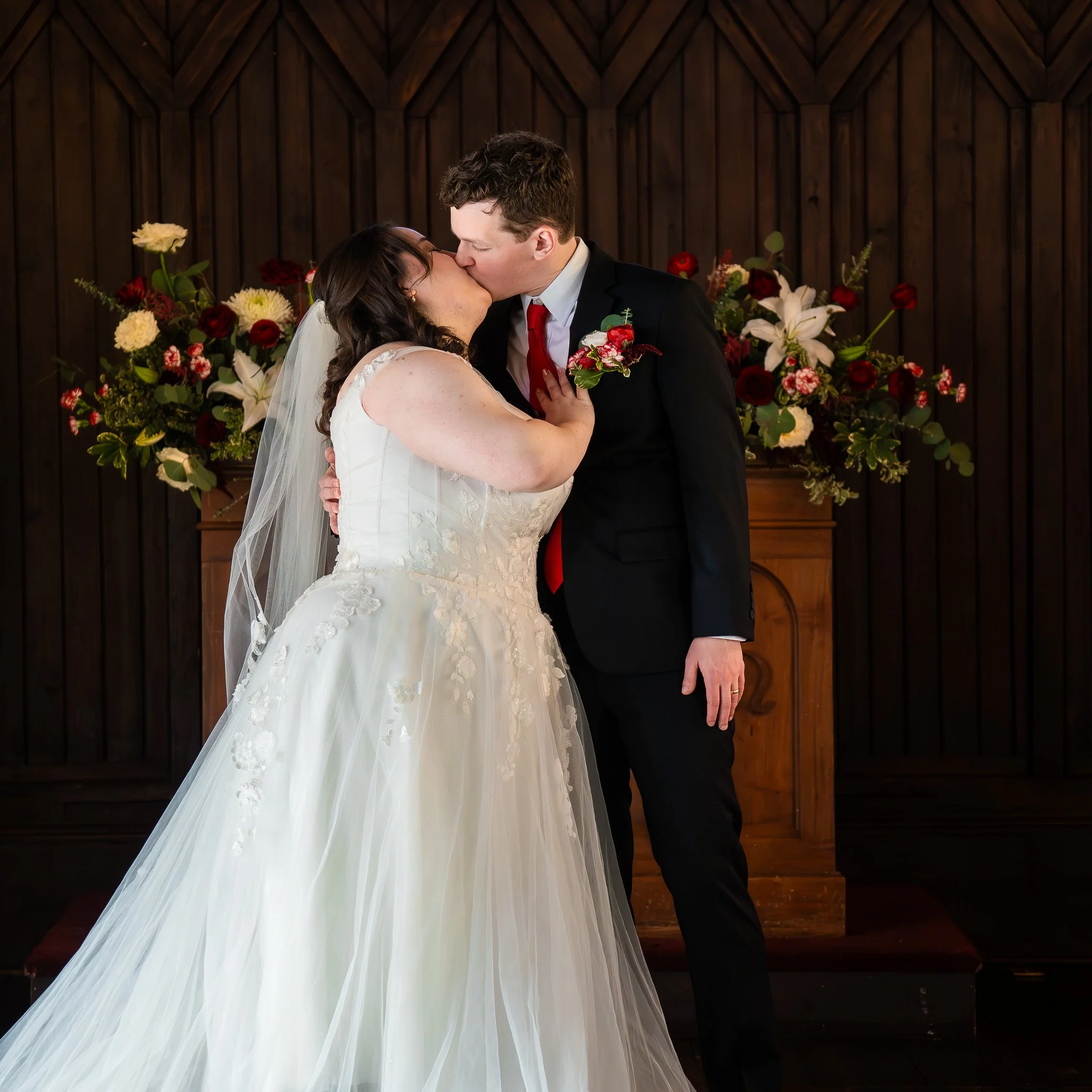 all-saints-chapel-raleigh-nc-wedding-ceremony-embrace.jpg