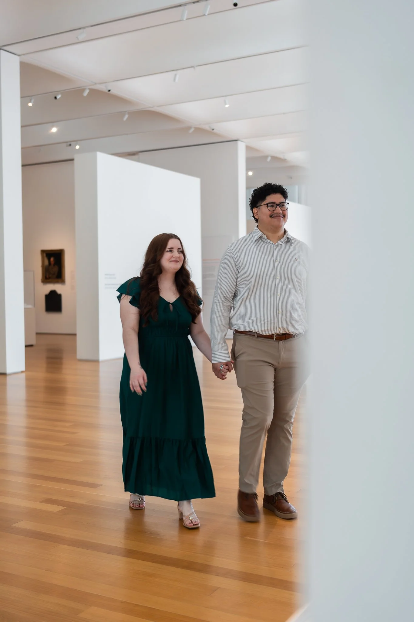 nc-museum-of-art-raleigh-nc-engagement-session-walking-inside-museum.jpg