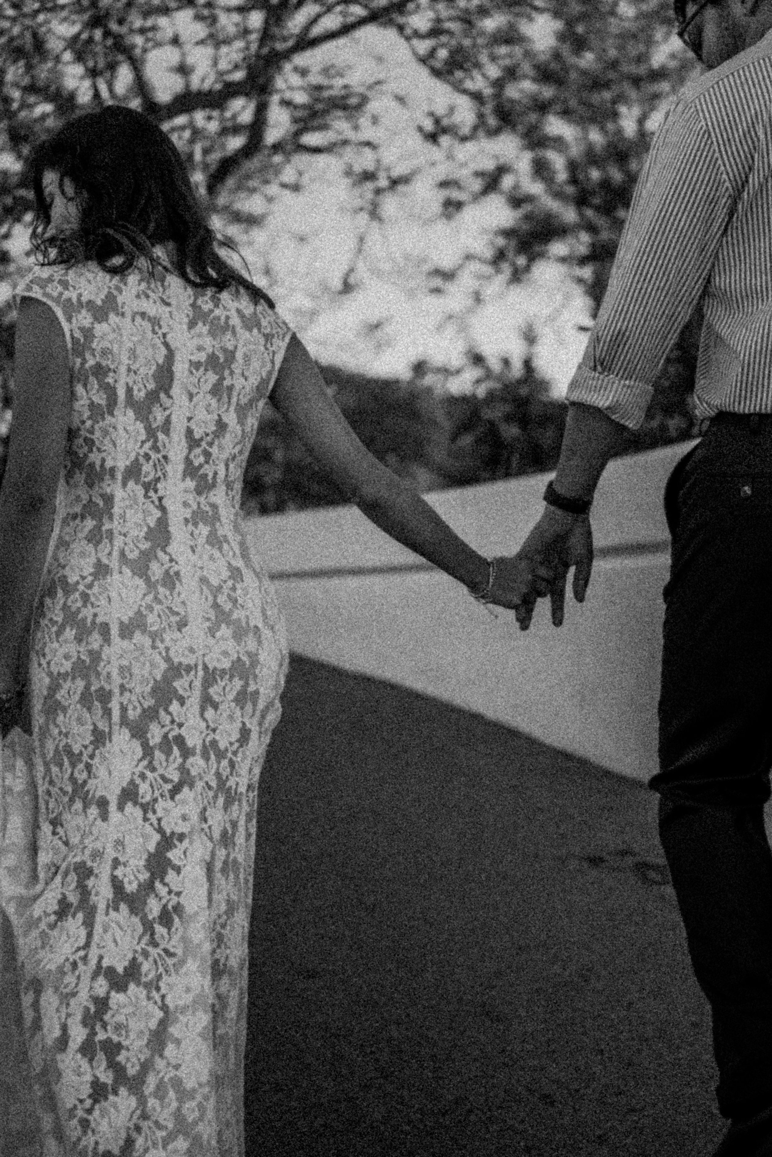 griffith-observatory-los-angeles-couples-session-holding-hands-black-and-white.jpg