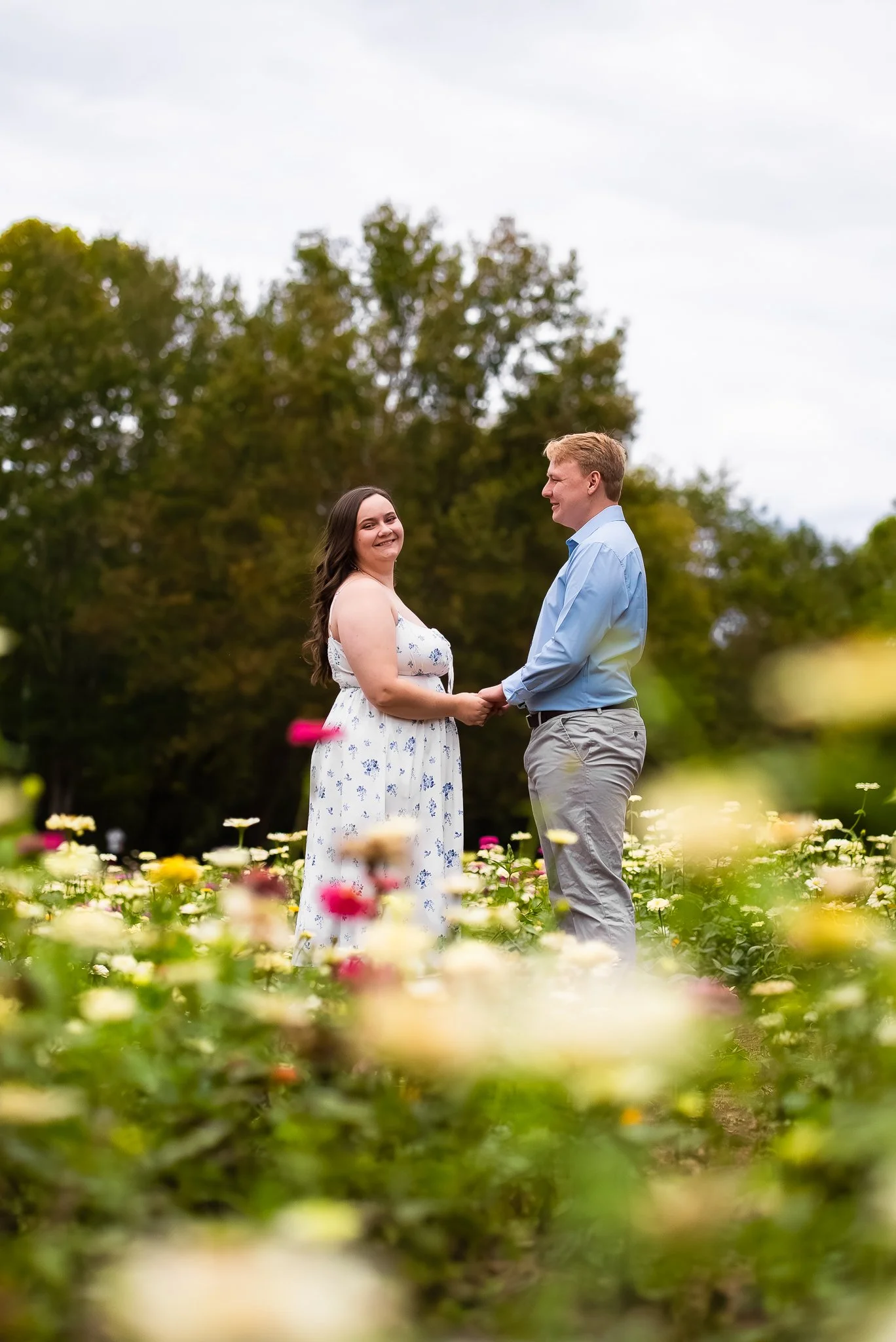 dorothea-dix-park-engagement-session-raleigh-nc-holding-hands-field-kzk-visuals.jpg