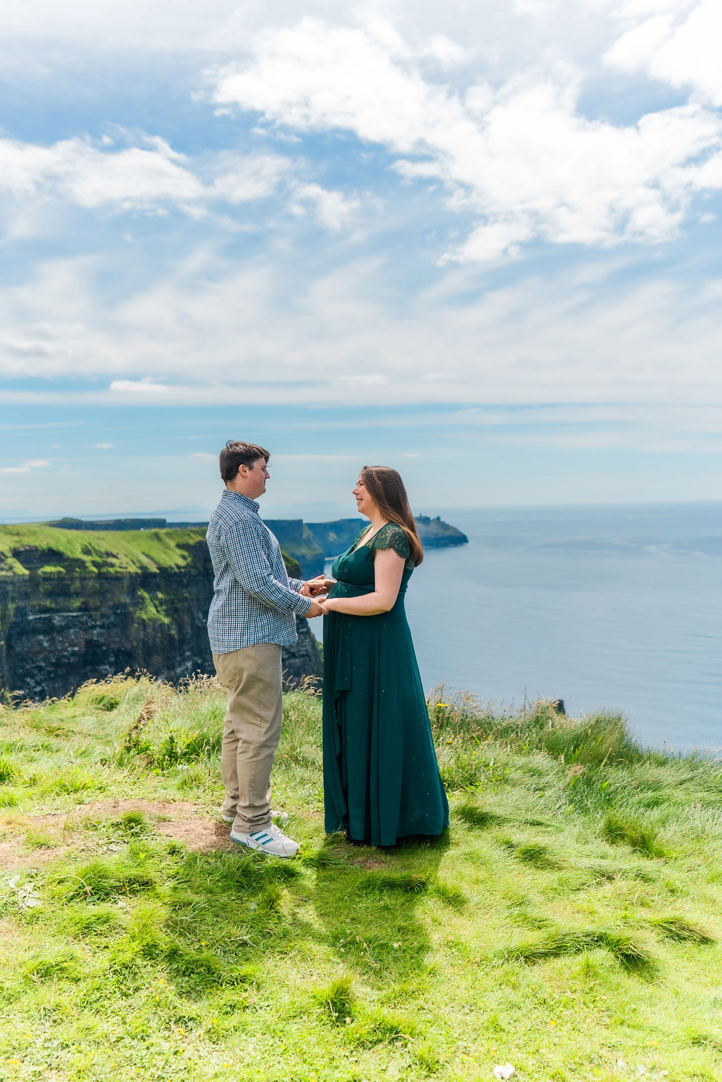cliffs-of-moher-county-clare-ireland-maternity-session-holding-hands.jpg
