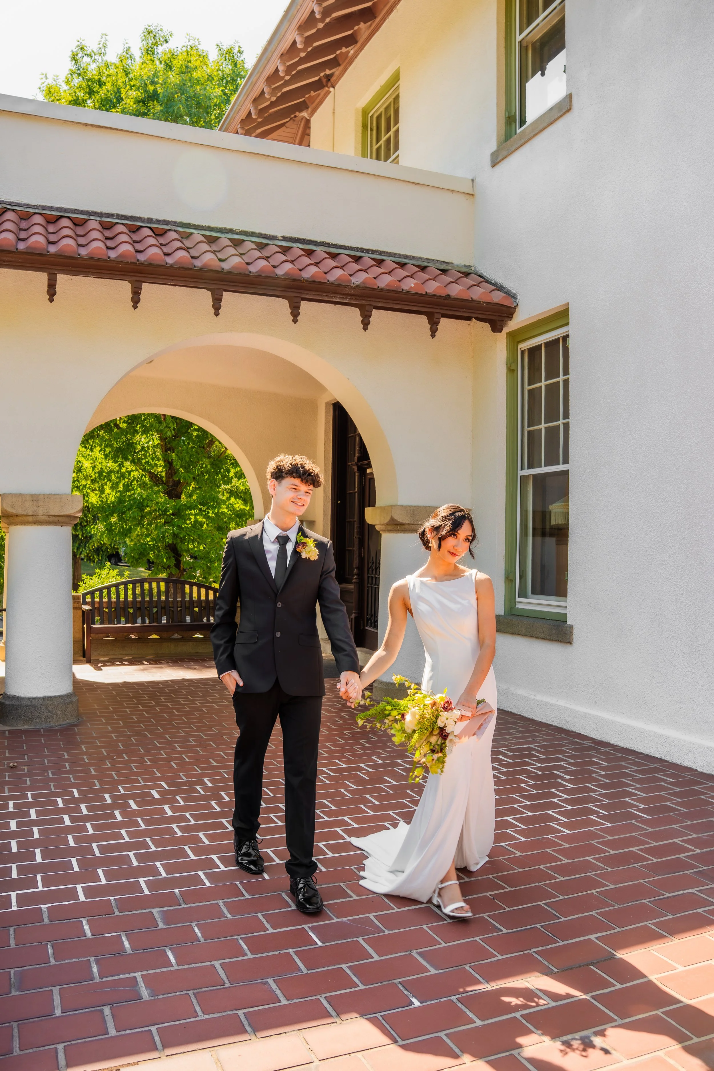 hill-house-durham-nc-wedding-walking-under-arch.jpg