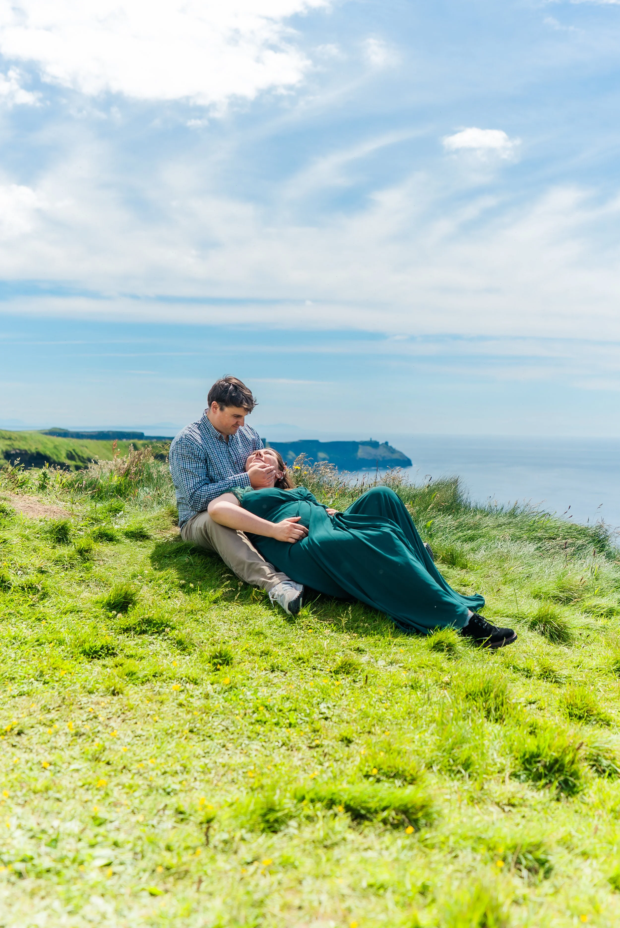 cliffs-of-moher-county-clare-ireland-maternity-session-sitting-on-grass.jpg