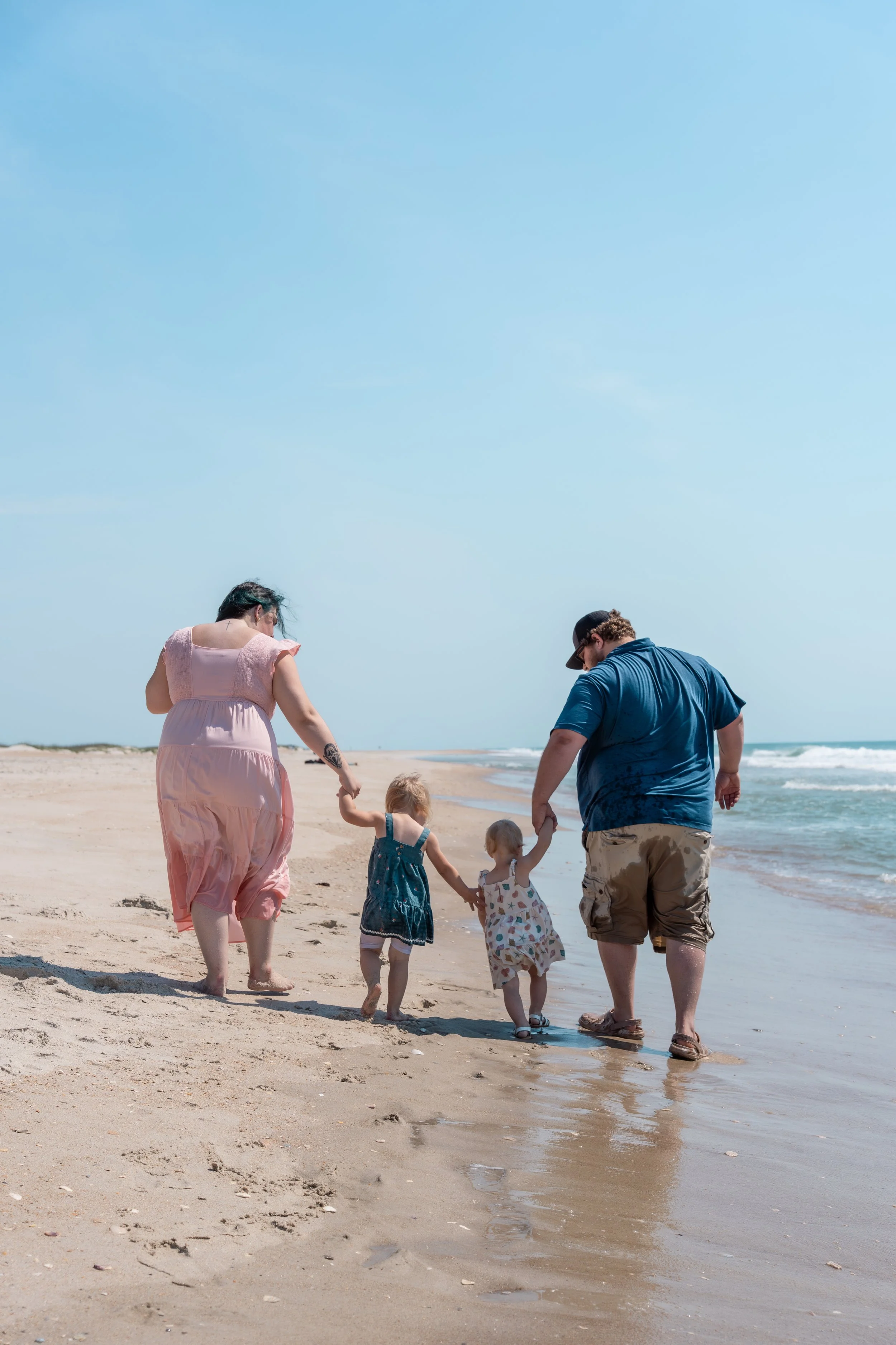 cape-lookout-nc-family-walking-along-shore.jpg