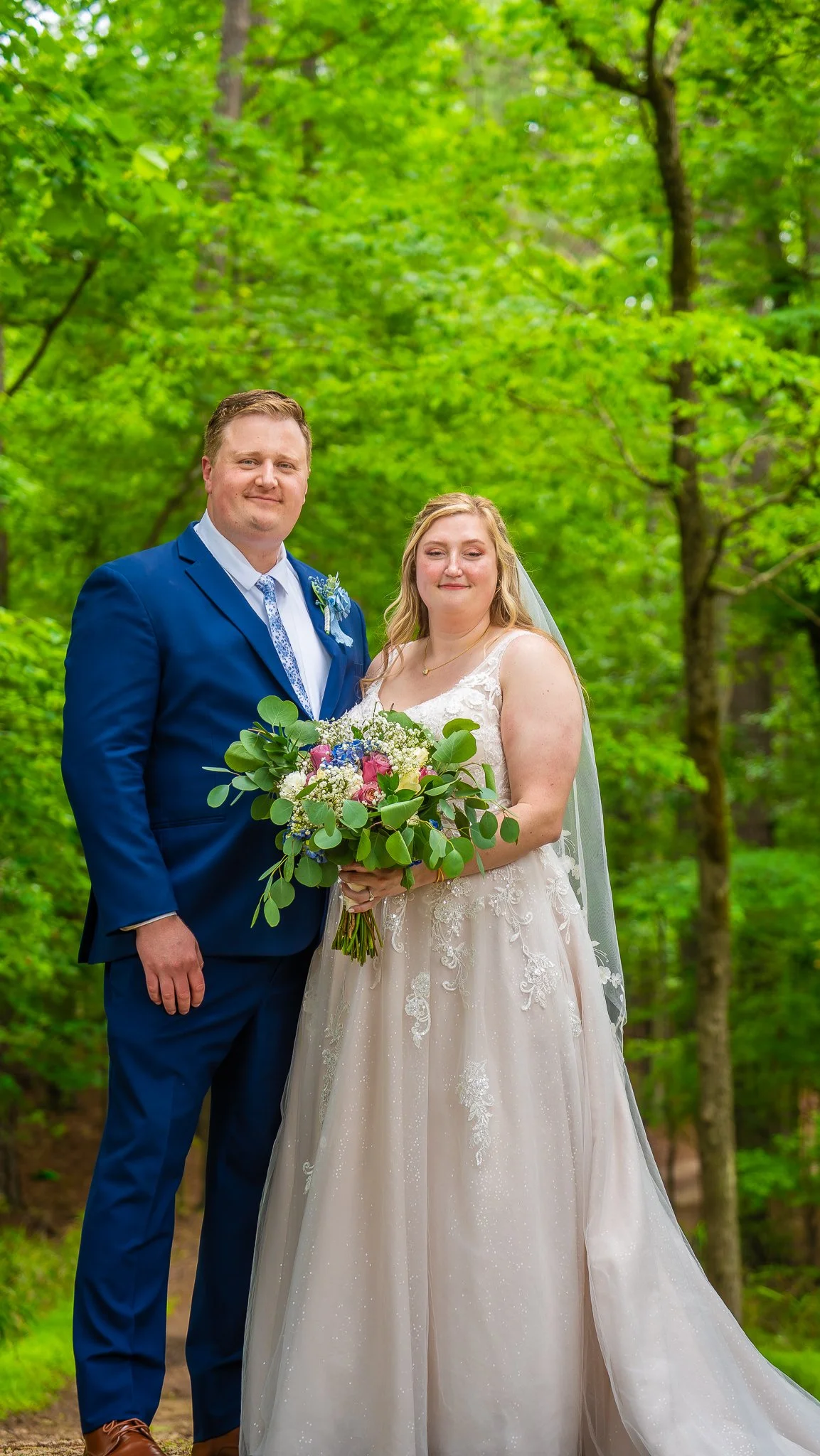 april-john-wedding-couple-standing-together-forest-mini-acre-farms-raleigh-nc.jpg