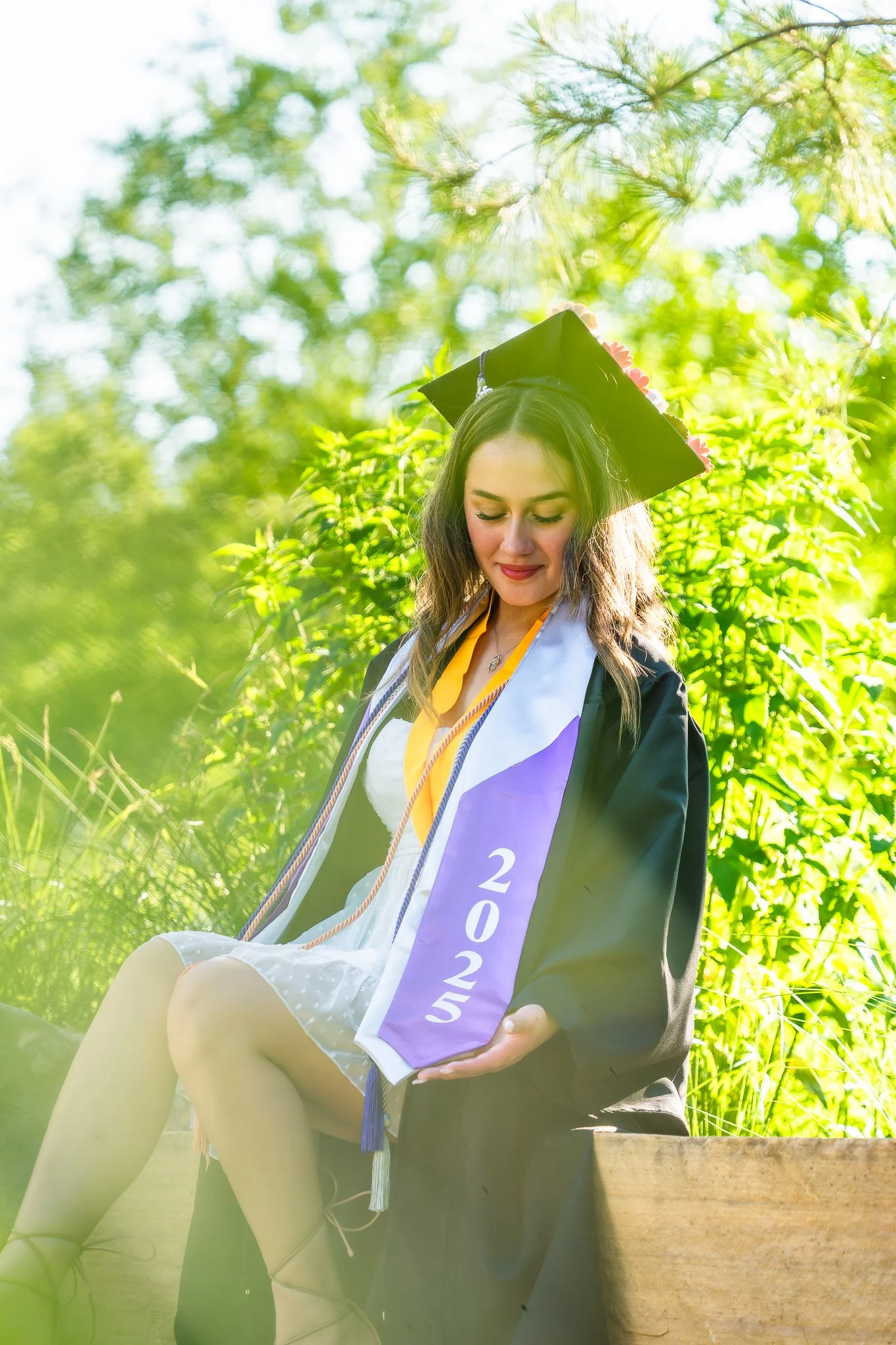 downtown-cary-park-graduation-session-cap-and-gown-greenery.jpg