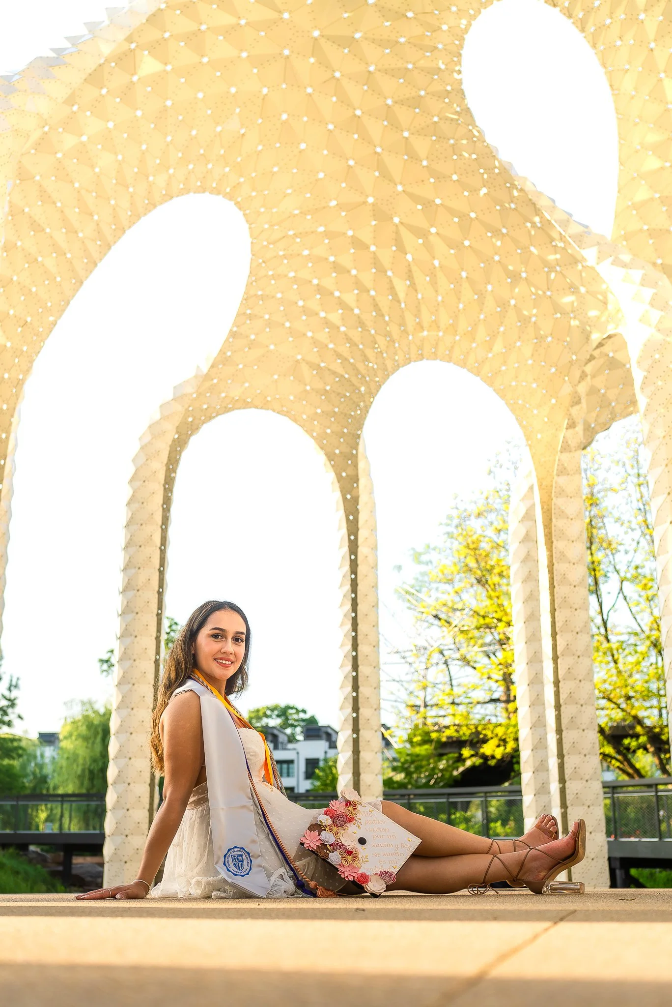 downtown-cary-park-graduation-session-arches-sitting.jpg