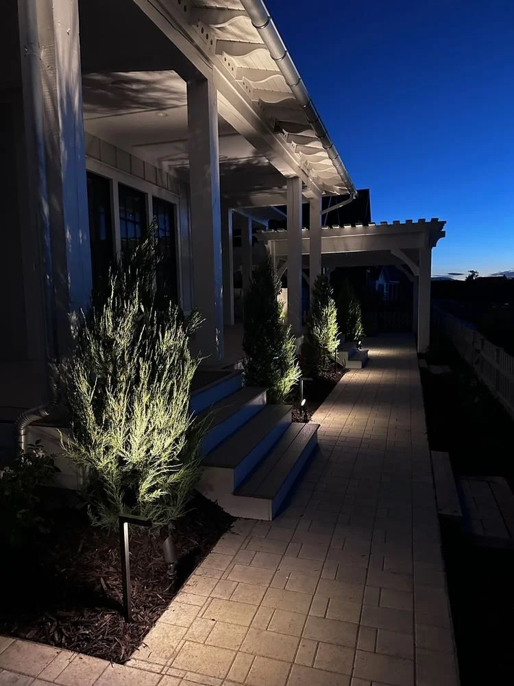 Beautiful interlocking paver pathway and landscape lighting by Kodiak Landscape® in South Jordan, Utah