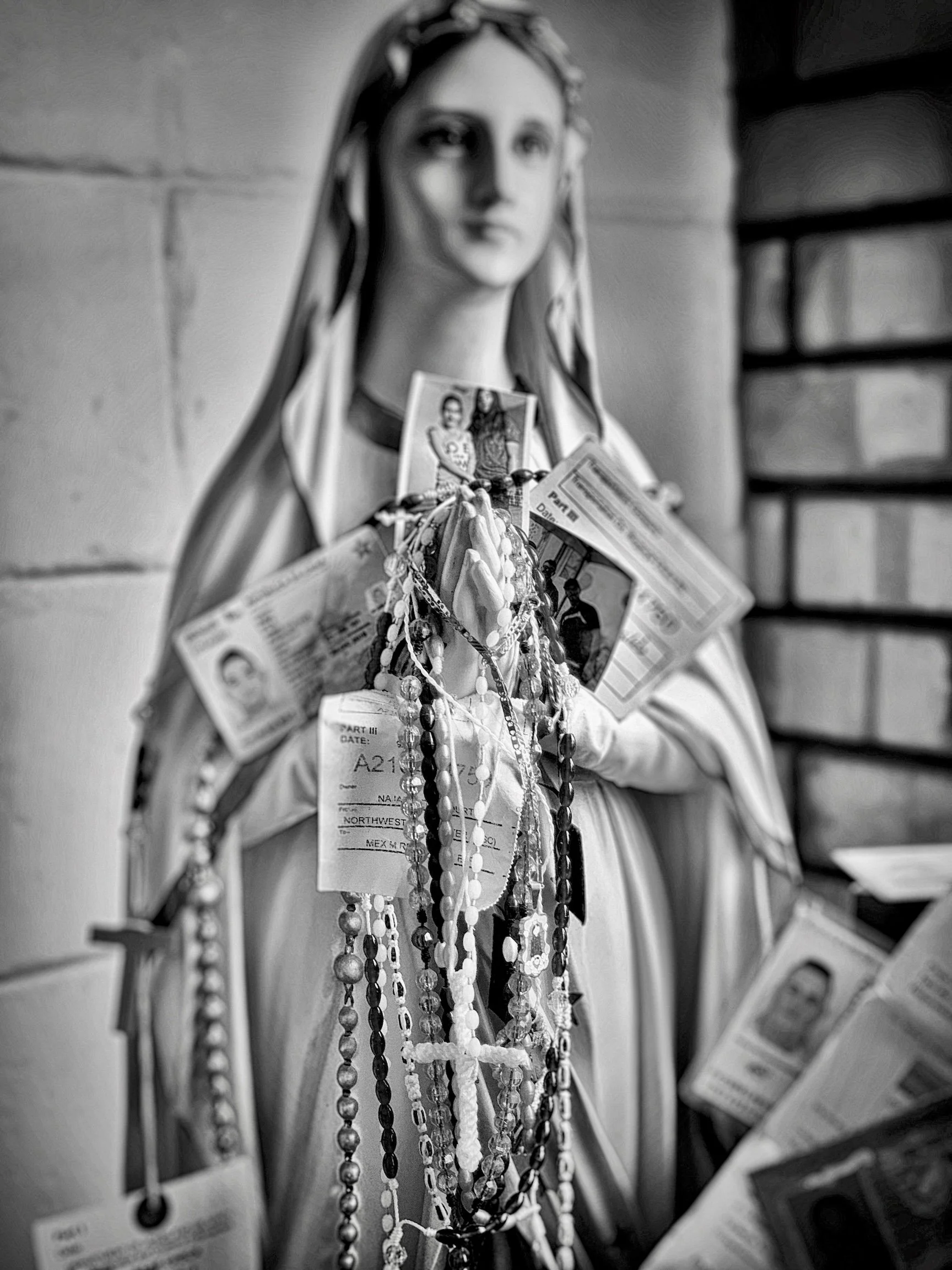 VIrgin with Necklace of MIgrant ID Cards_Juarez, Mexico 2019.jpeg