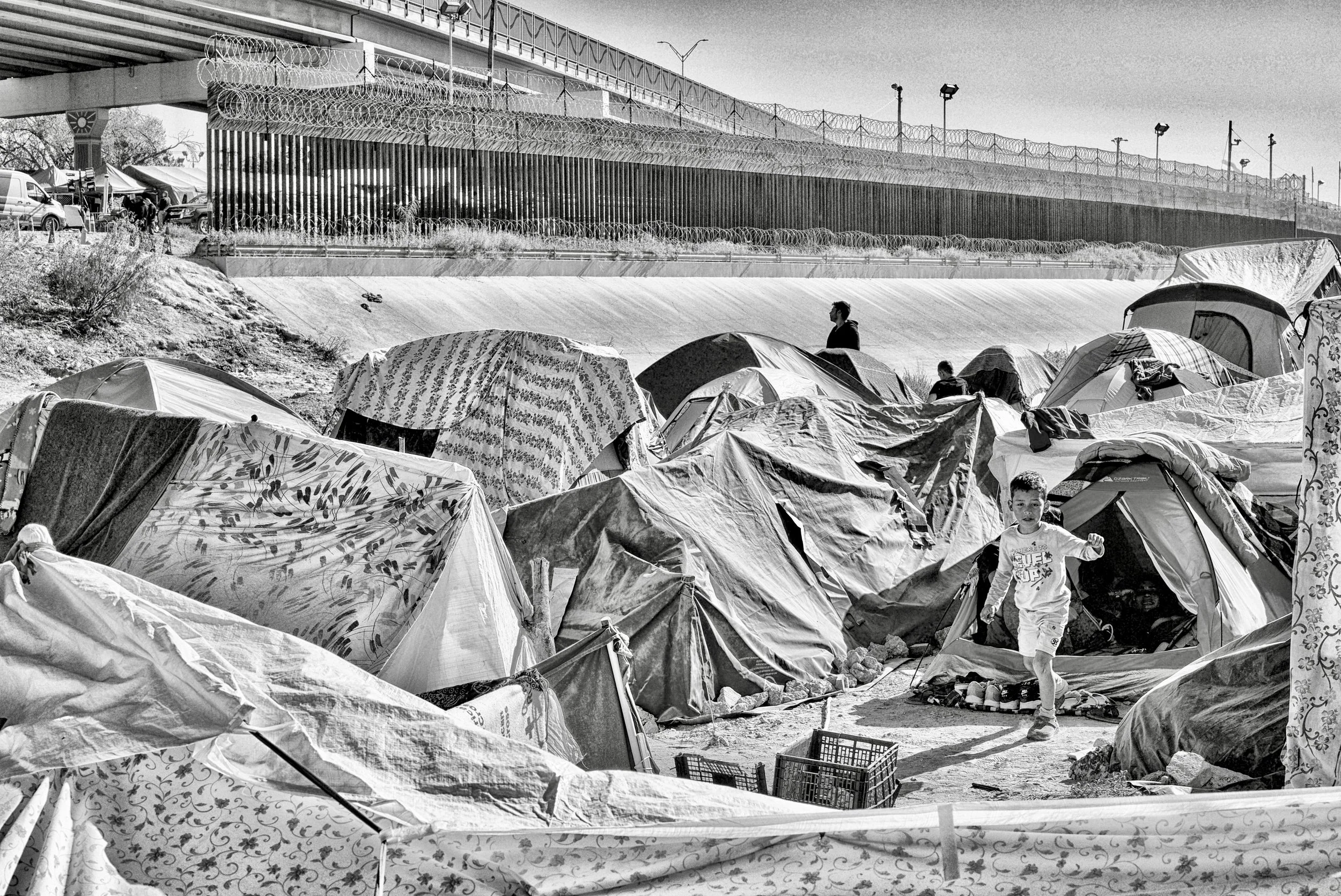 Boy at Venezuelan Encampment at the Wall_Juarez, Mexico 2022.jpeg