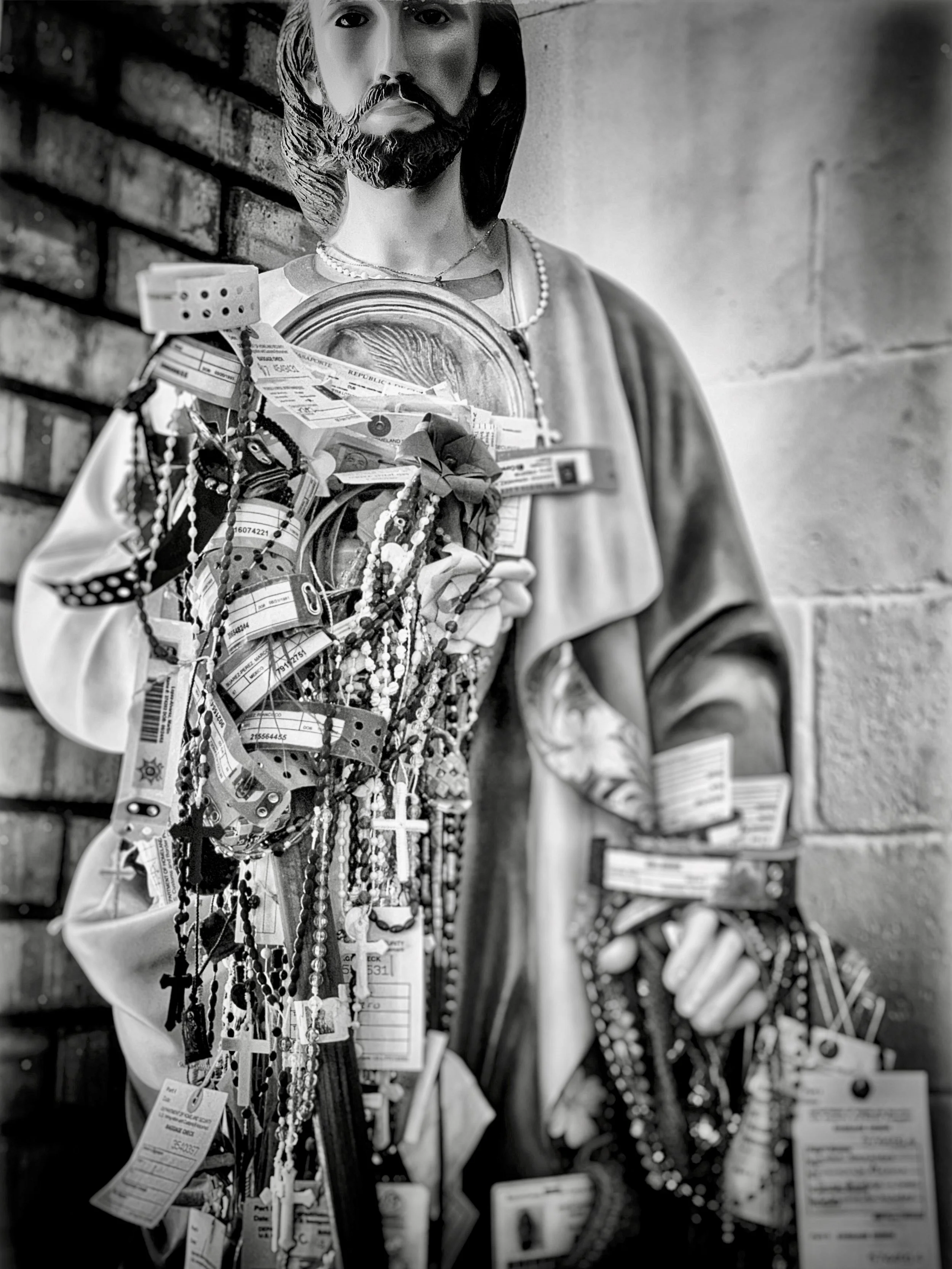 Migrant ID's Draped Around Statue of Jesus_Juarez, Mexico 2019.jpeg