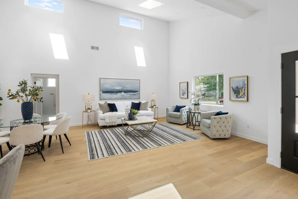 Best interior real estate photography of a bright, modern living room – high ceilings, natural light, and staging captured by Intuition Real Estate Media for high-end California listings.