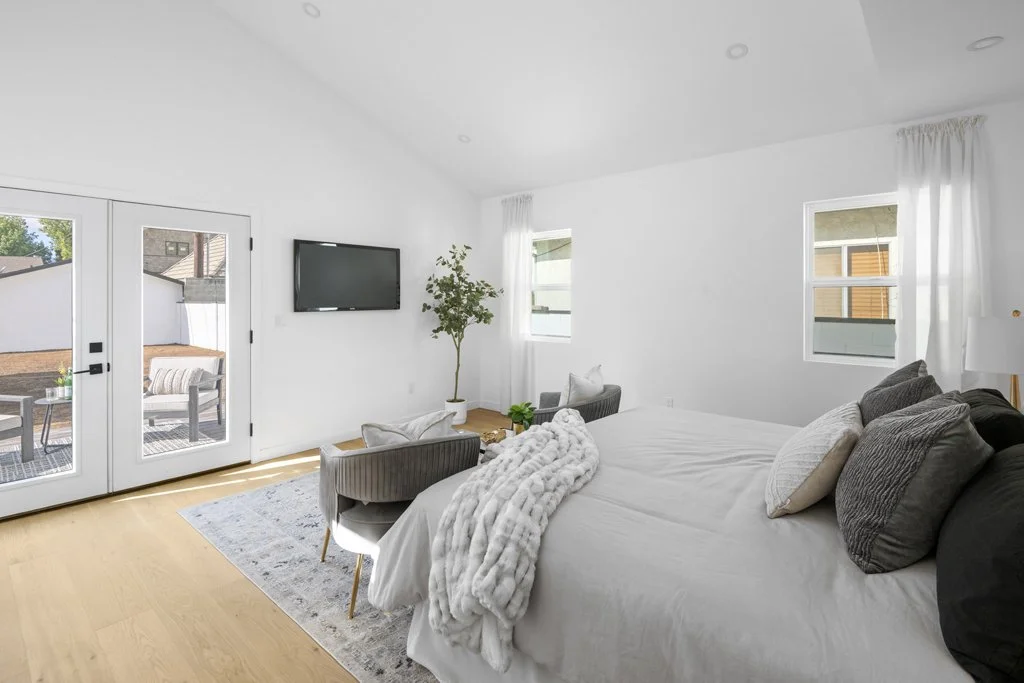 Real estate photography of bright minimalist bedroom with patio access – affordable Los Angeles interiors by Intuition Real Estate Photography & Imaging.