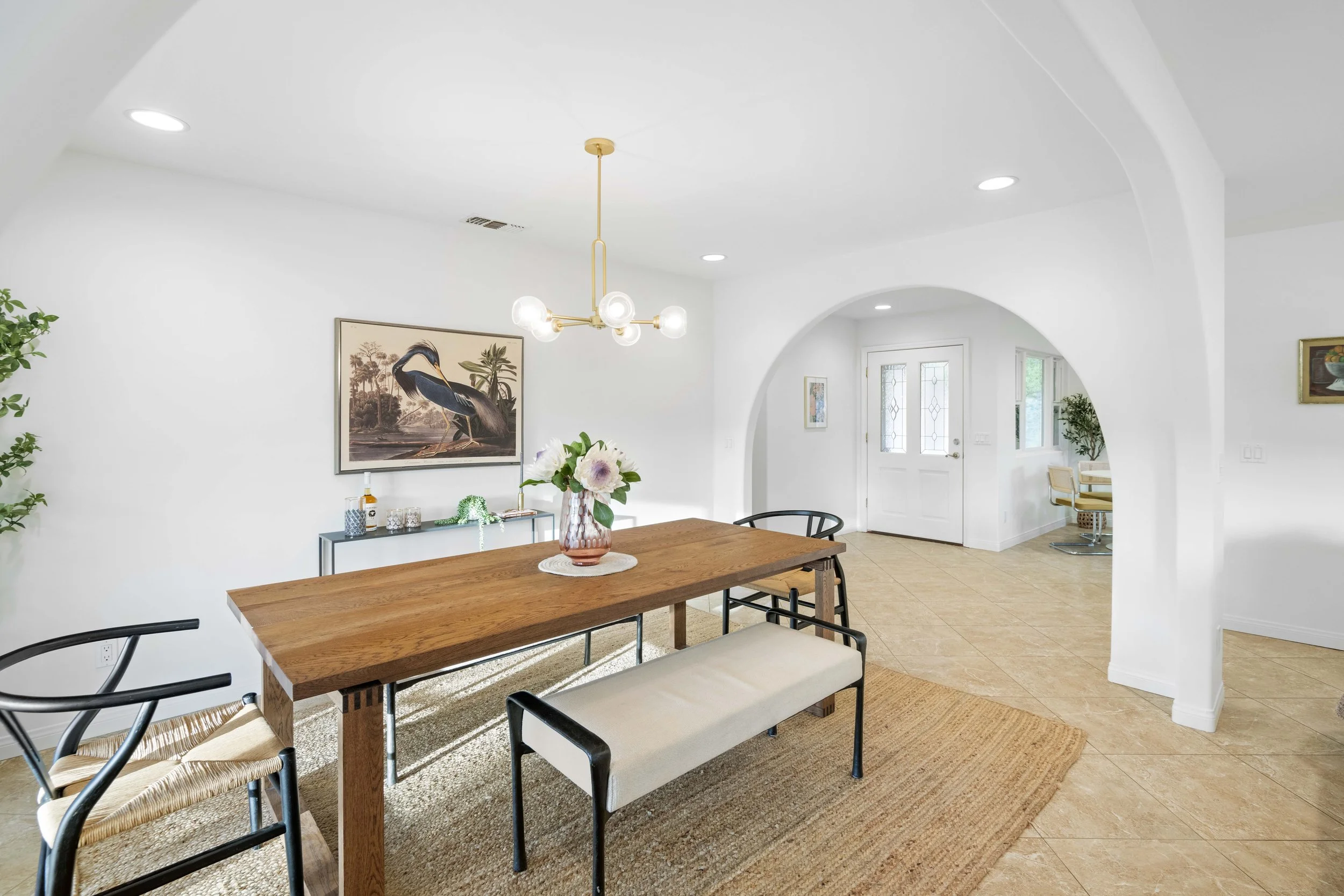 Elegant Los Angeles dining space with arched entry and modern décor — photographed by Intuition Real Estate Media for stylish property listings and interior branding.