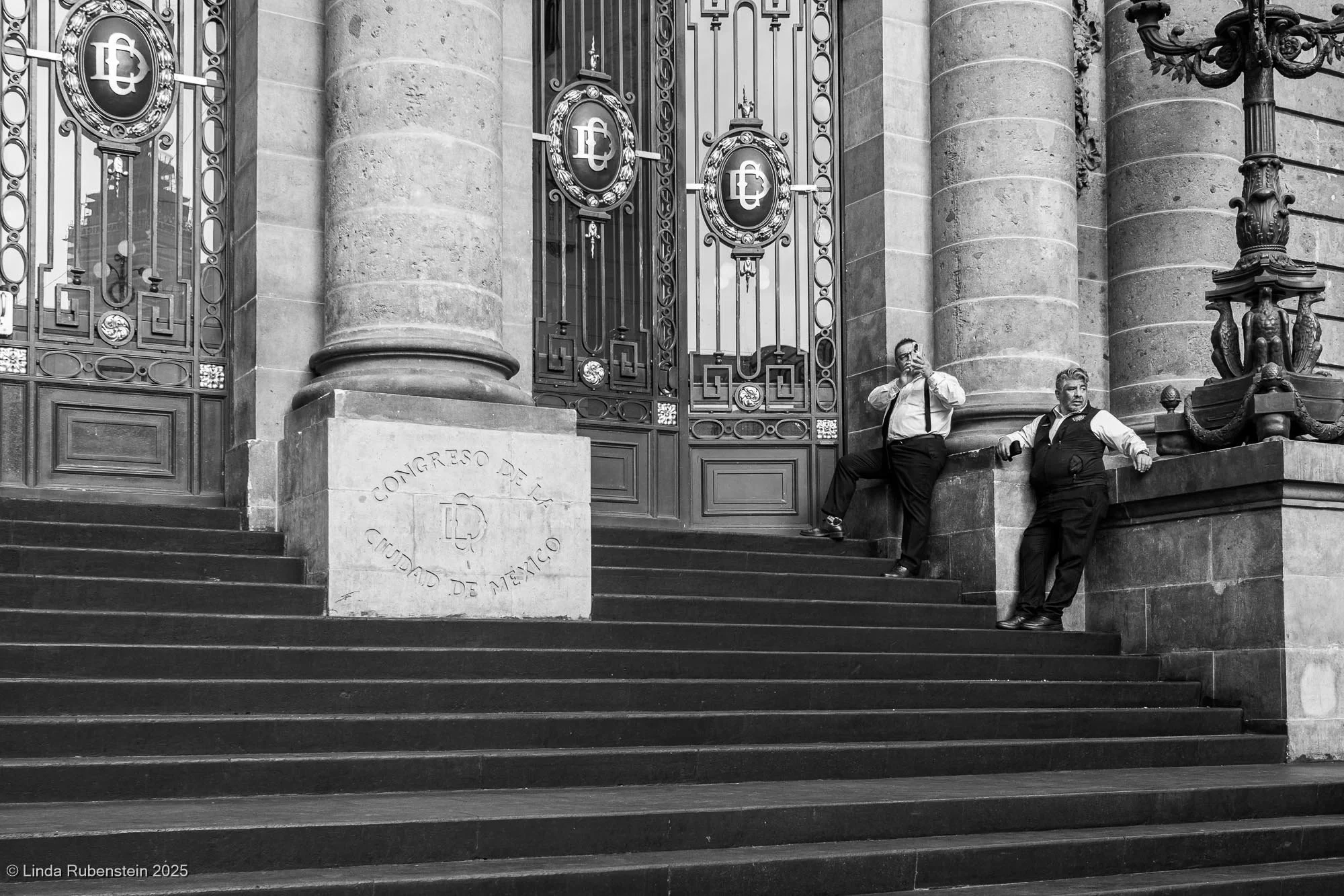 Men on steps of Congreso de la Ciudad de Mexico Mexico City