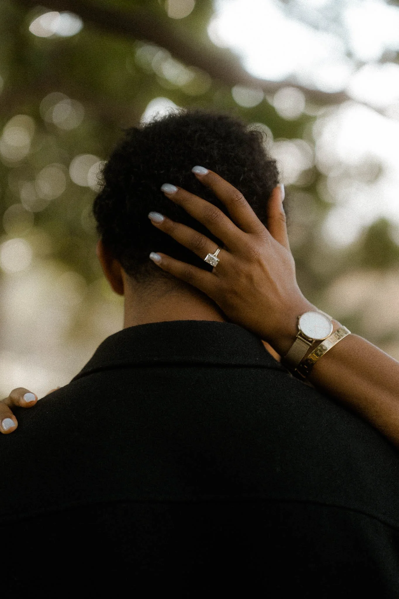 engagement-ring-hand-on-neck.jpg
